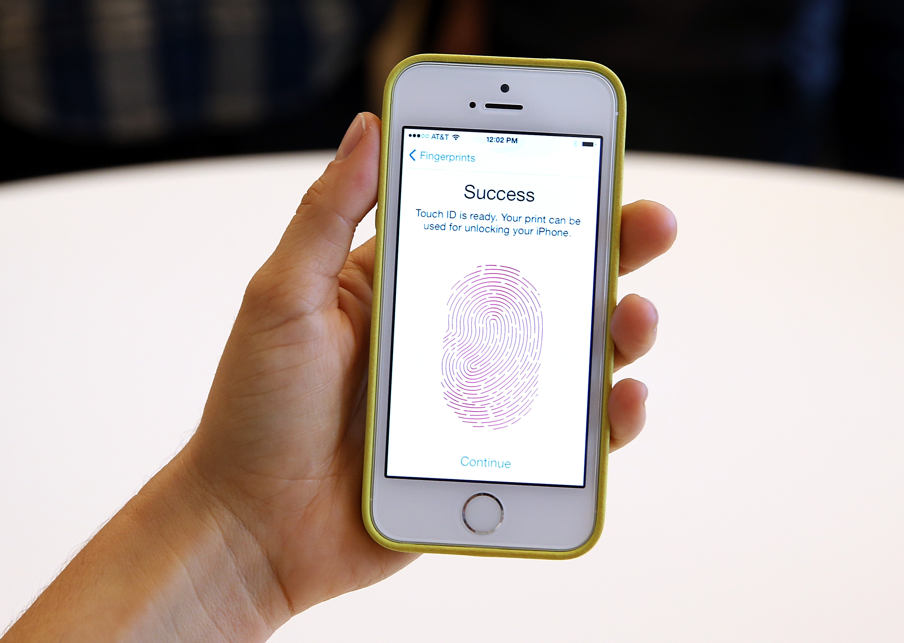 The new iPhone 5S with fingerprint technology is displayed during an Apple product announcement at the Apple campus on September 10, 2013 in Cupertino, California. (Justin Sullivan—Getty Images)