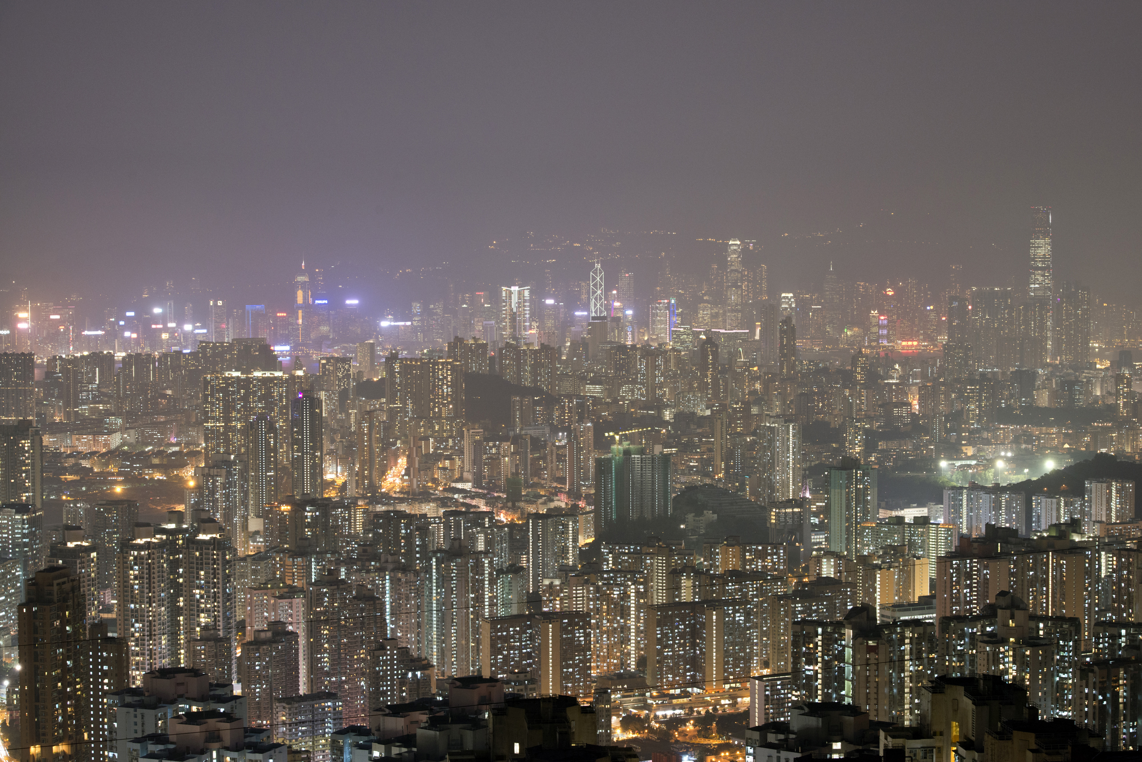 This long exposure picture shows apartment buildings and office blocks clustered tightly together in Hong Kong's Kowloon district, with the famous skyline of Hong Kong island in the background, on October 28, 2013. (Alex Ogle—‚AFP/Getty Images)