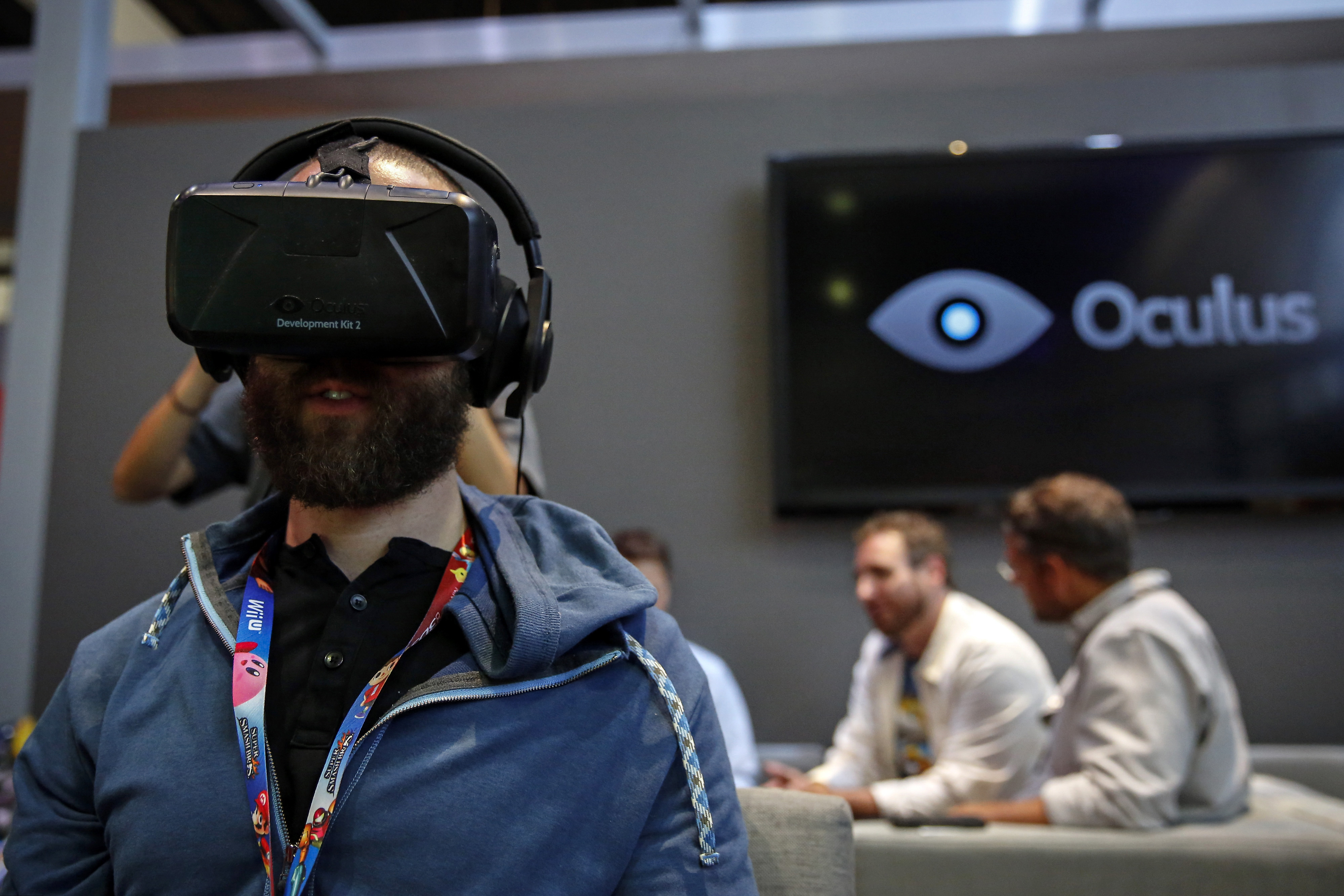 An attendee wears an Oculus VR Inc. Rift Development Kit 2 headset to play a video game during the E3 Electronic Entertainment Expo in Los Angeles, California, U.S., on Wednesday, June 11, 2014. (Patrick T. Fallon—Bloomberg/Getty Images)