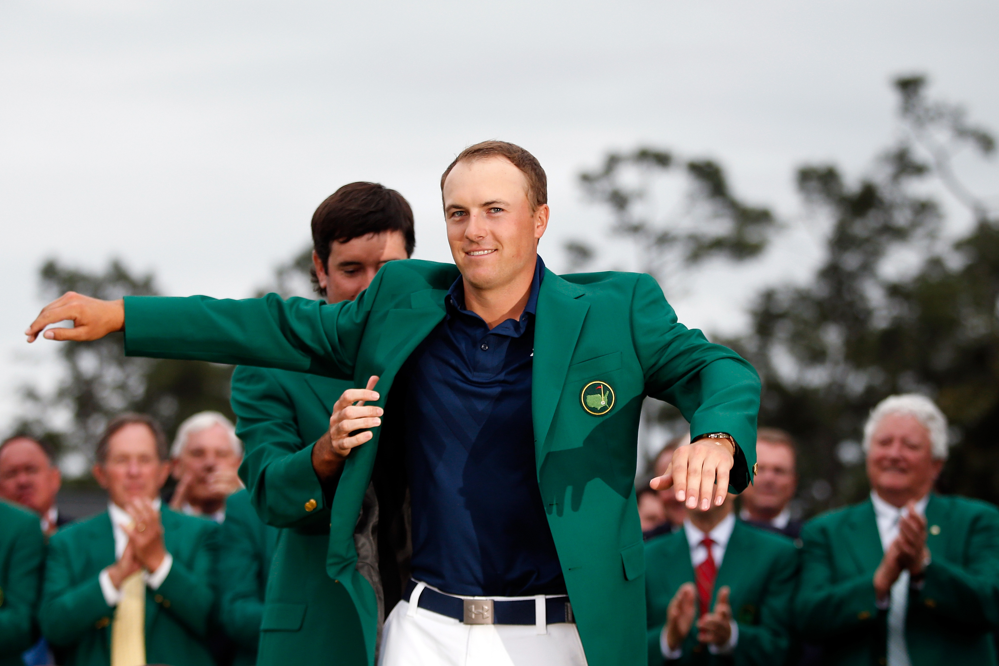 Bubba Watson presents Jordan Spieth of the United States with the green jacket after Spieth won the 2015 Masters Tournament at Augusta National Golf Club on April 12, 2015 in Augusta, Georgia. (Ezra Shaw&mdash;Getty Images)