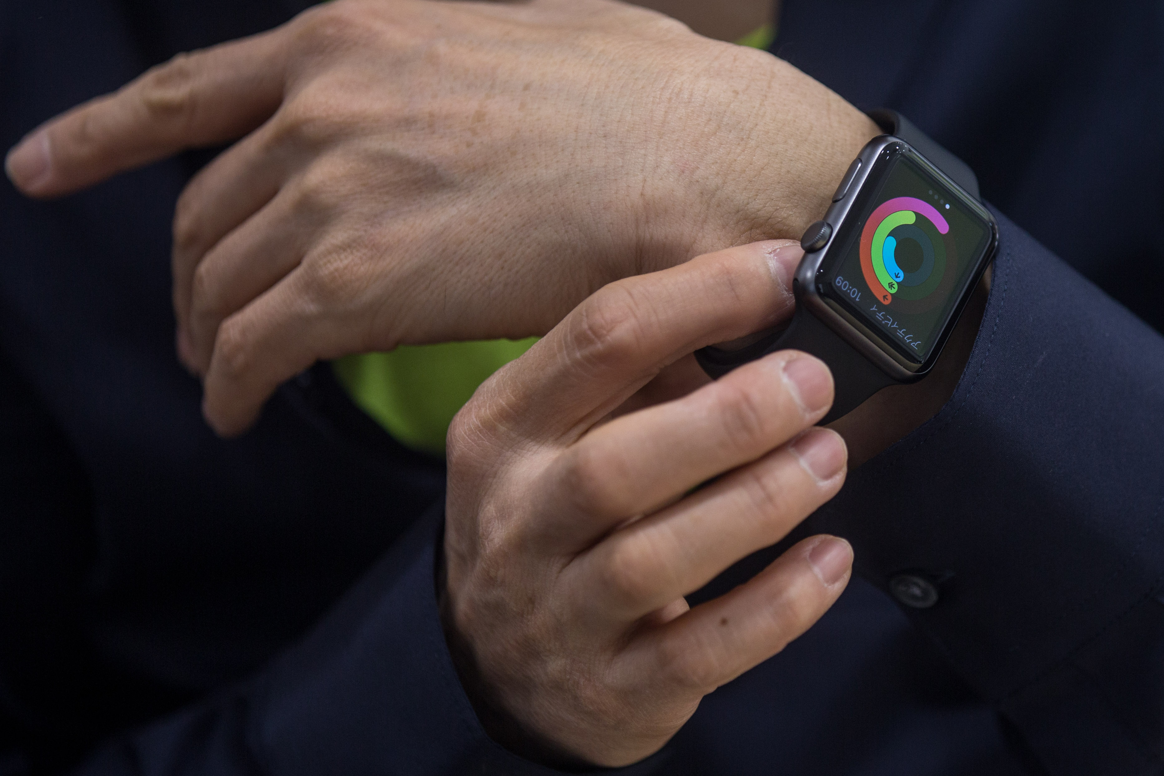 A customer tries on an Apple Watch at a store on April 24, 2015 in Tokyo, Japan. (Chris McGrath)