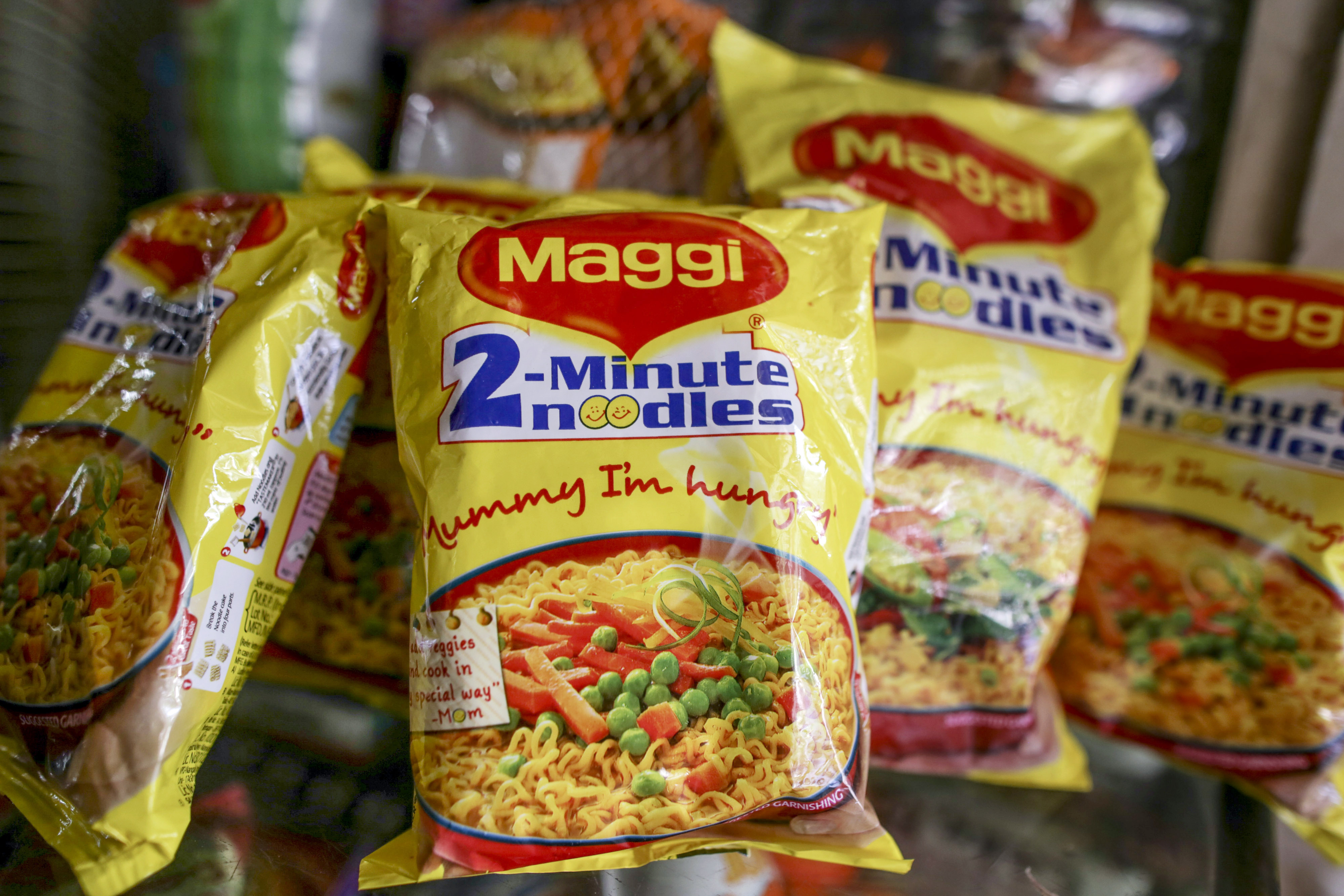 Packets of Maggi 2-Minute Noodles, manufactured by Nestle India Ltd., center, are arranged for a photograph at a general store in Mumbai, India, on Tuesday, June 2, 2015. (Dhiraj Singh—Bloomberg/Getty Images)
