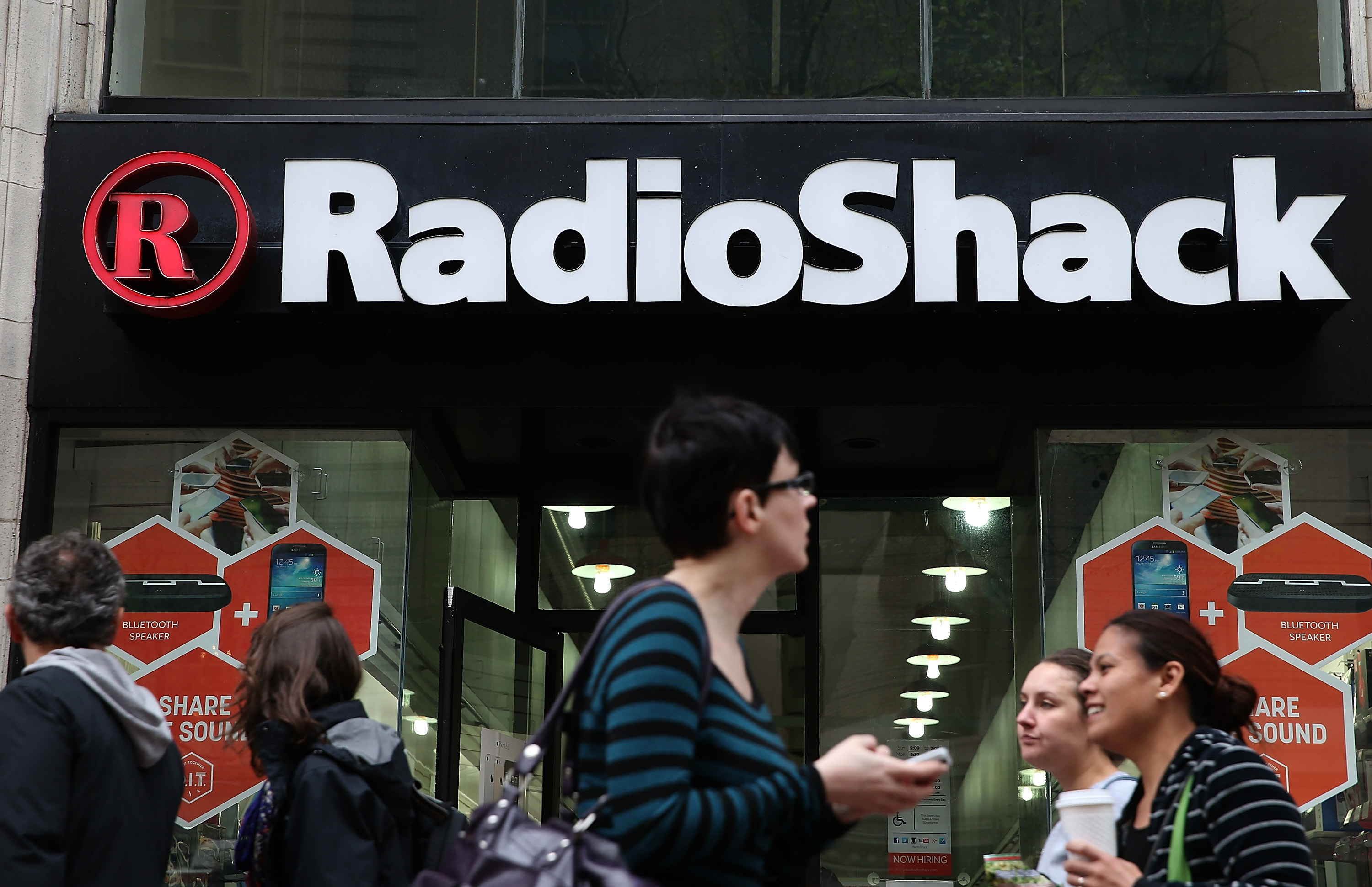 People walk by a Radio Shack store on March 4, 2014 in San Francisco, California. (Justin Sullivan&mdash;Getty Images)