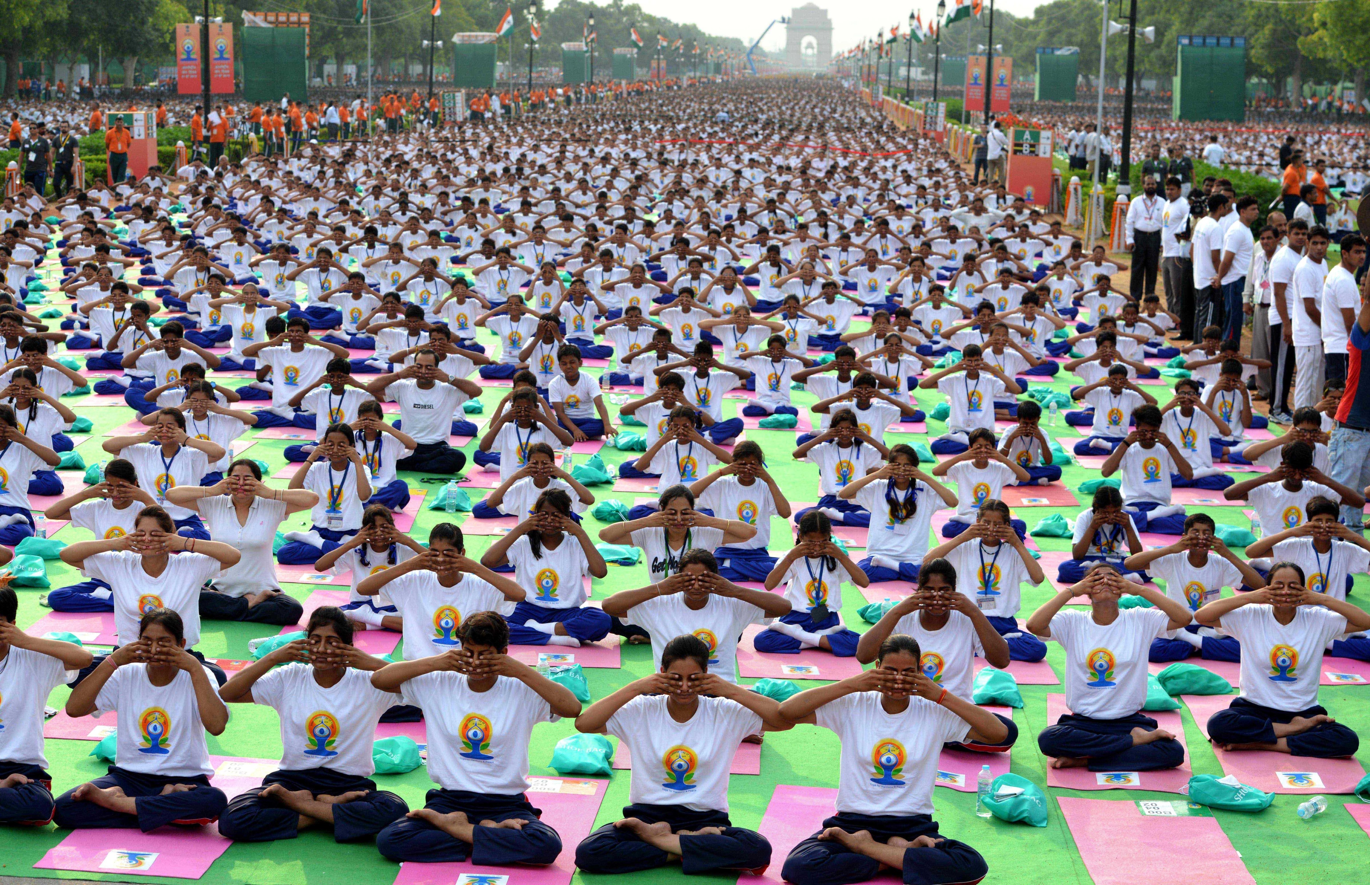 Thousands gather for a mass yoga session to mark International Yoga Day on June 21, 2015, at Rajpath in New Delhi (Vinod Singh—Anadolu Agency/Getty Images)