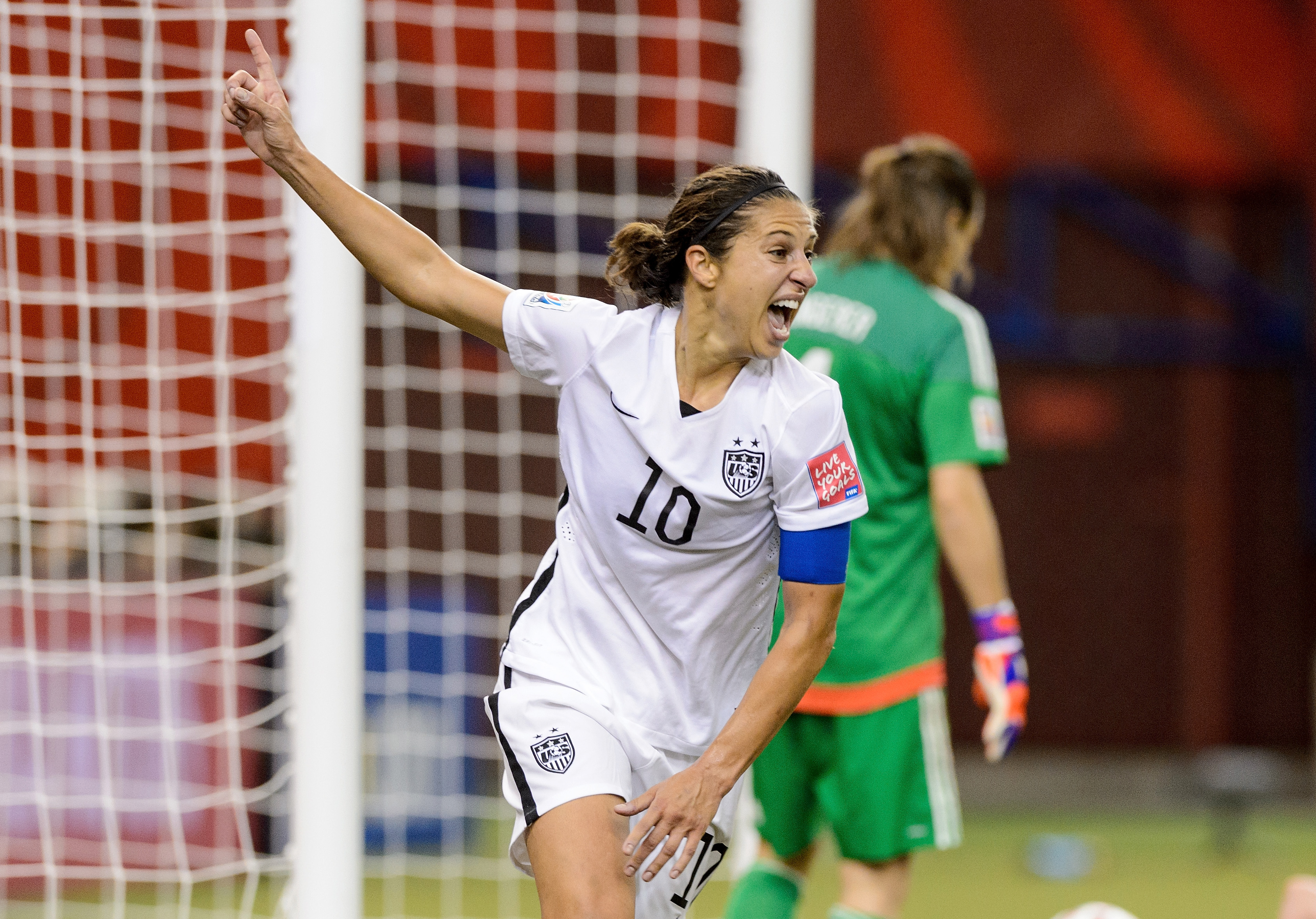 Carli Lloyd celebrates setting up Kelly O'Hara's goal in the FIFA Women's World Cup 2015 Semi-Final Match at Olympic Stadium on June 30, 2015 in Montreal, Canada. (Minas Panagiotakis—Getty Images)