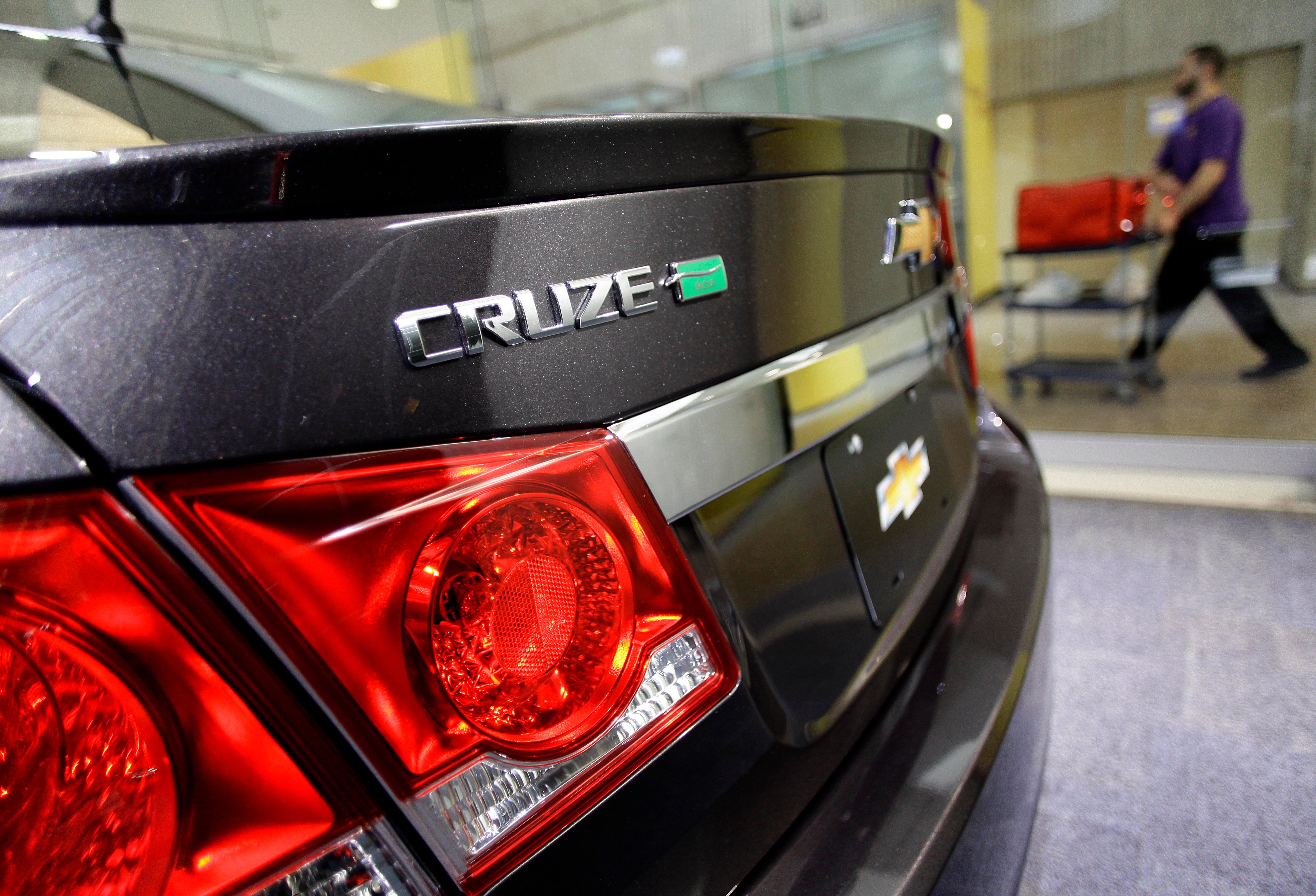 A man walks past a Chevrolet Cruze Eco displayed at the General Motors headquarters April 1, 2014 in Detroit, Michigan. (Joshua Lott&mdash;Getty Images)