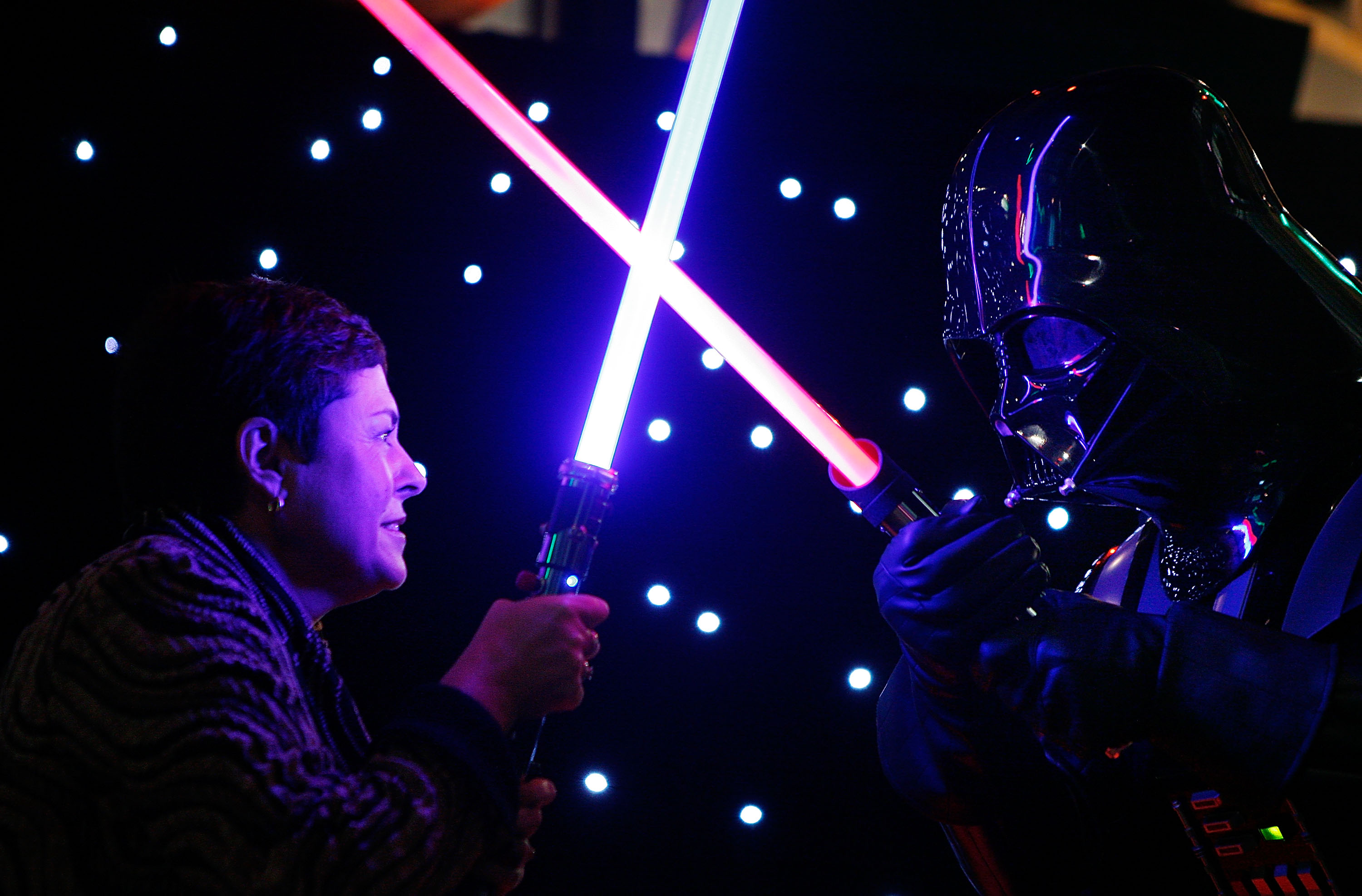 Lynne Kosky (L), Victoria's Minister for Public Transport and Minister for the Arts has a lightsaber battle with an actor dressed as Darth Vader during a preview to the 'Star Wars: Where Science Meets Imagination' exhibition at Scienceworks on June 2, 2009 in Melbourne, Australia. (Scott Barbour&mdash;Getty Images)