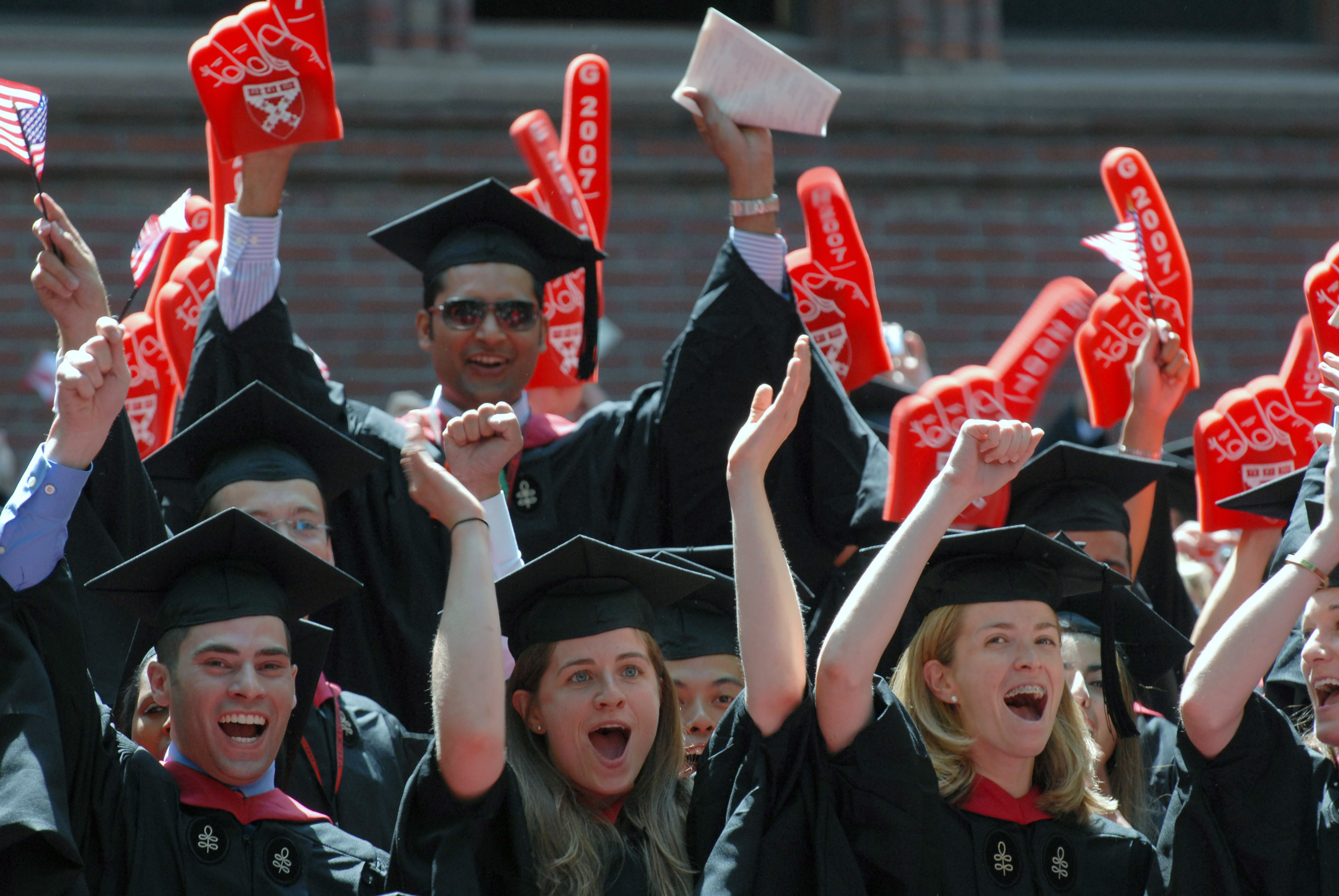 Harvard Business School students cheer as their MBA degrees