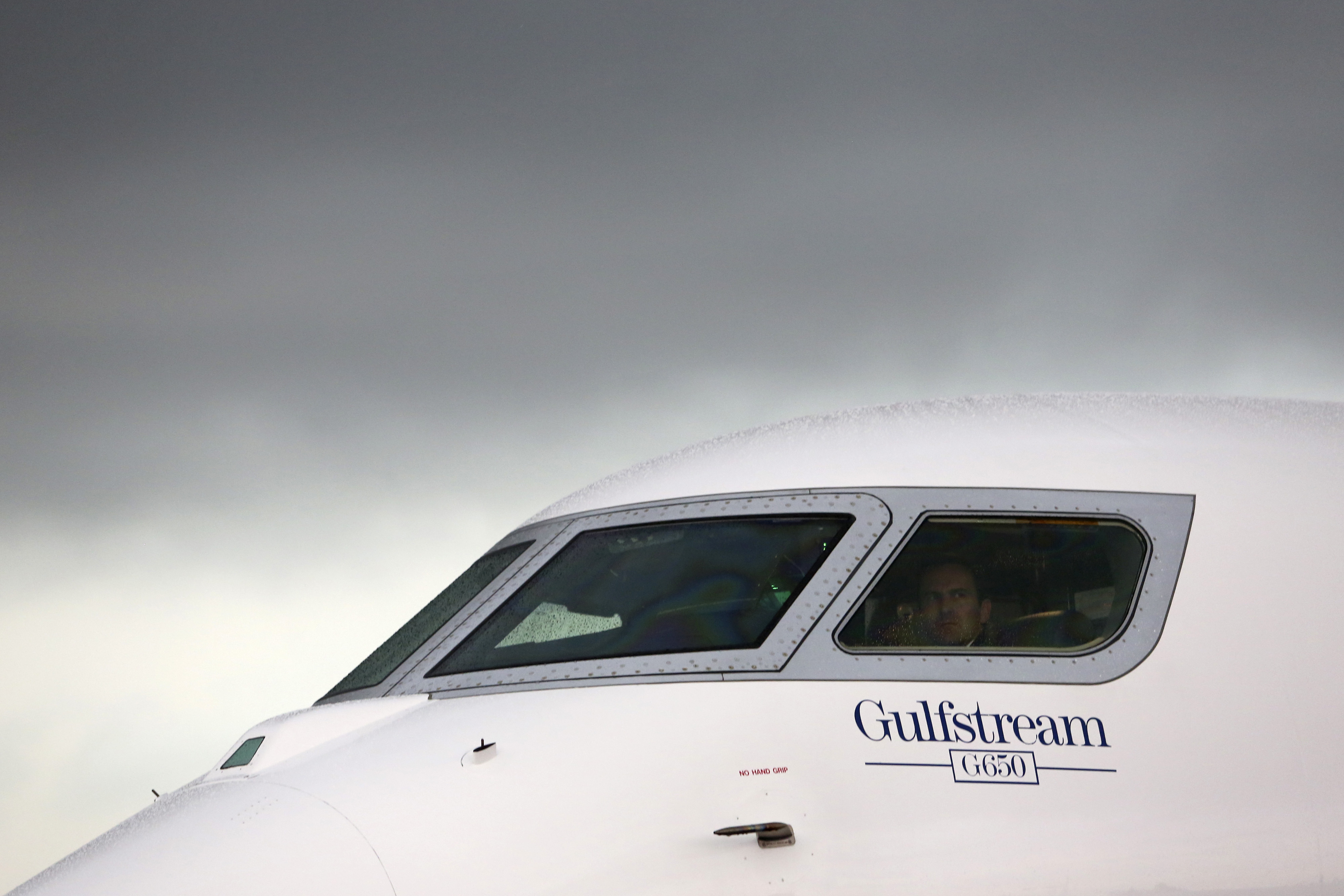 A logo sits beneath the cockpit window of a Gulfstream G650 business jet, manufactured by General Dynamics Corp., on the first day of the Paris Air Show in Paris on June 17, 2013. (Bloomberg via Getty Images)