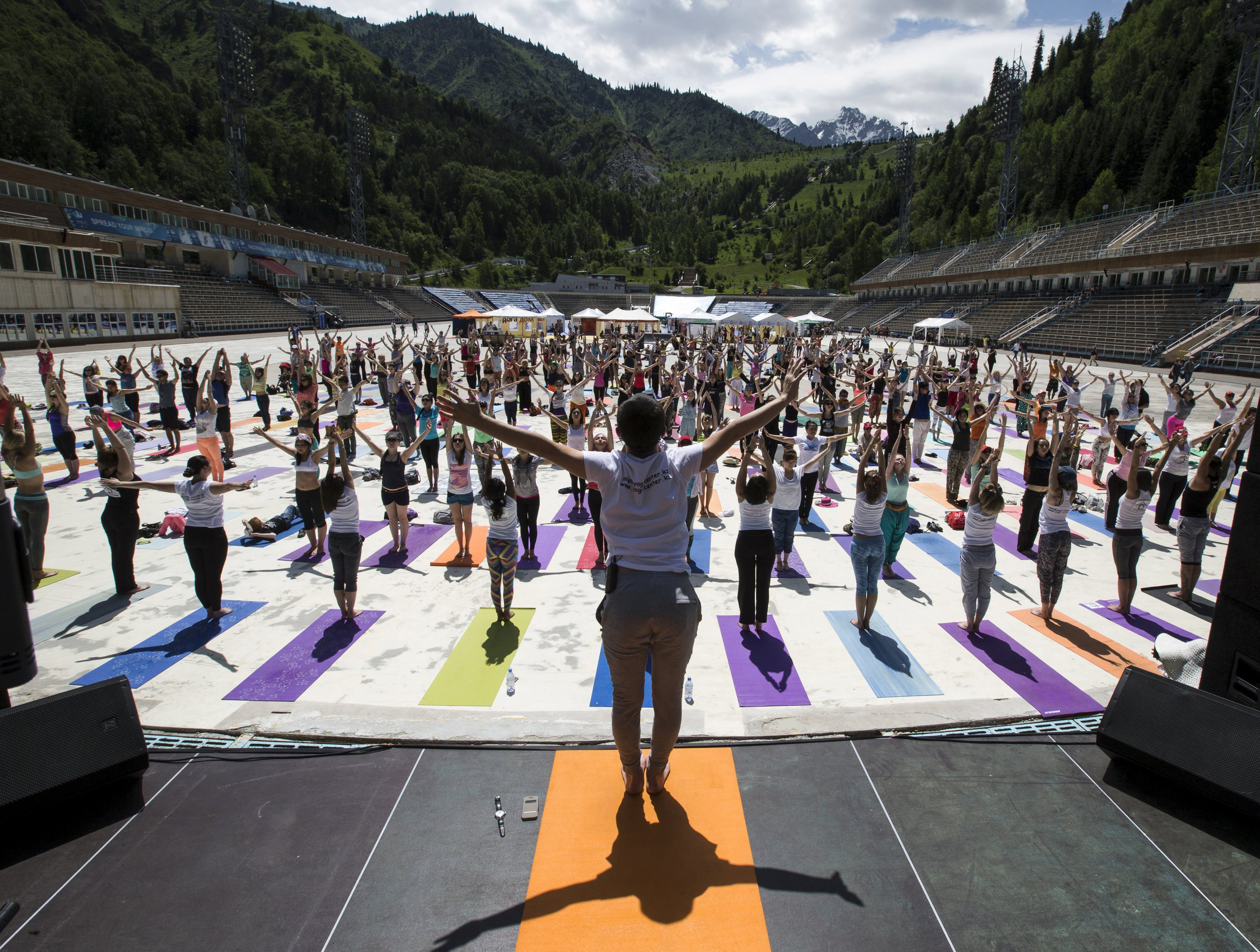 Participants attend the Yoga Fest to mark the International Day of Yoga at the Medeo skating rink in Almaty, Kazakhstan, on June 21, 2015.