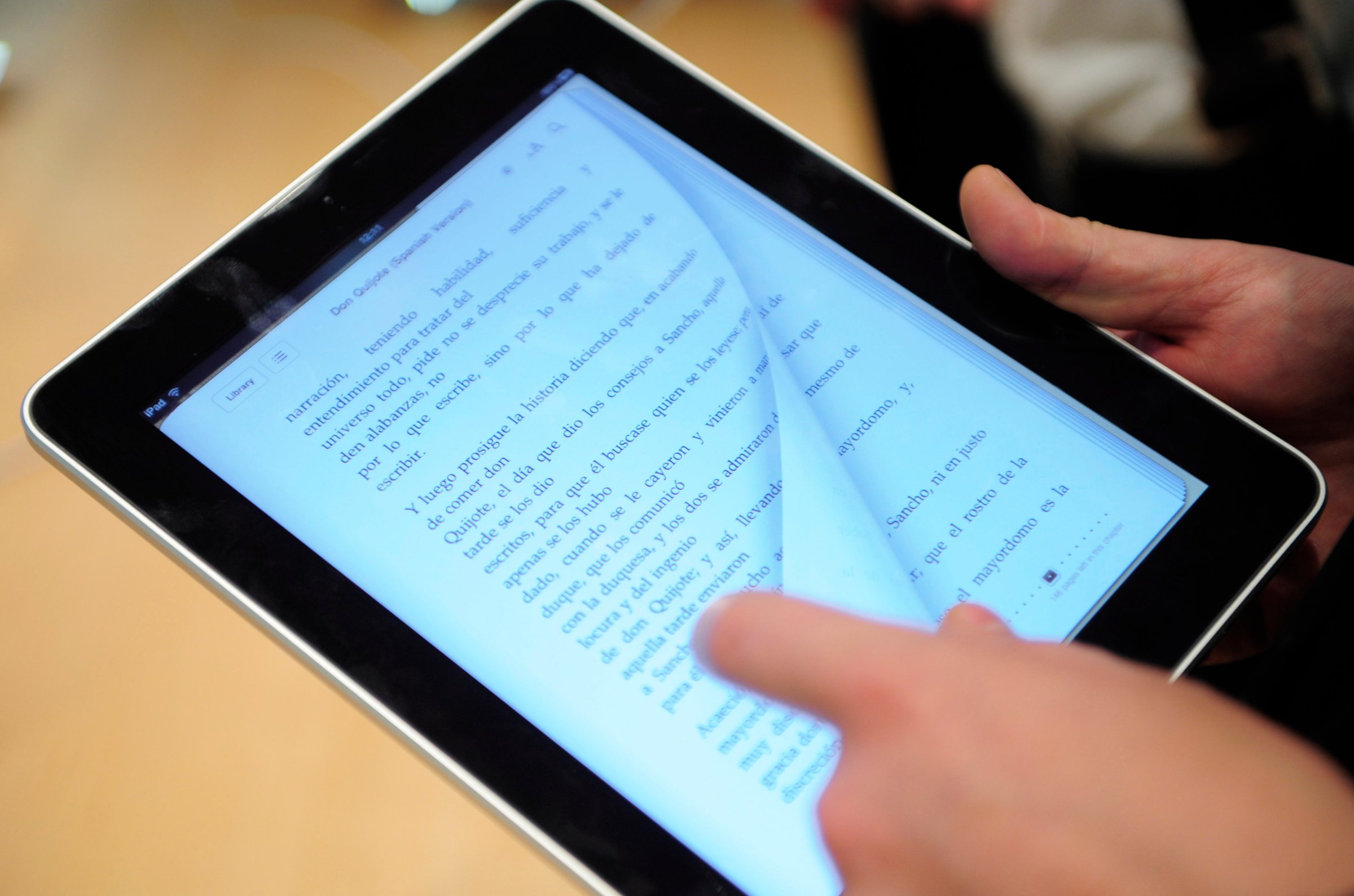 A customer is reading on an iPad at an Apple store Barcelona on May 28, 2010.