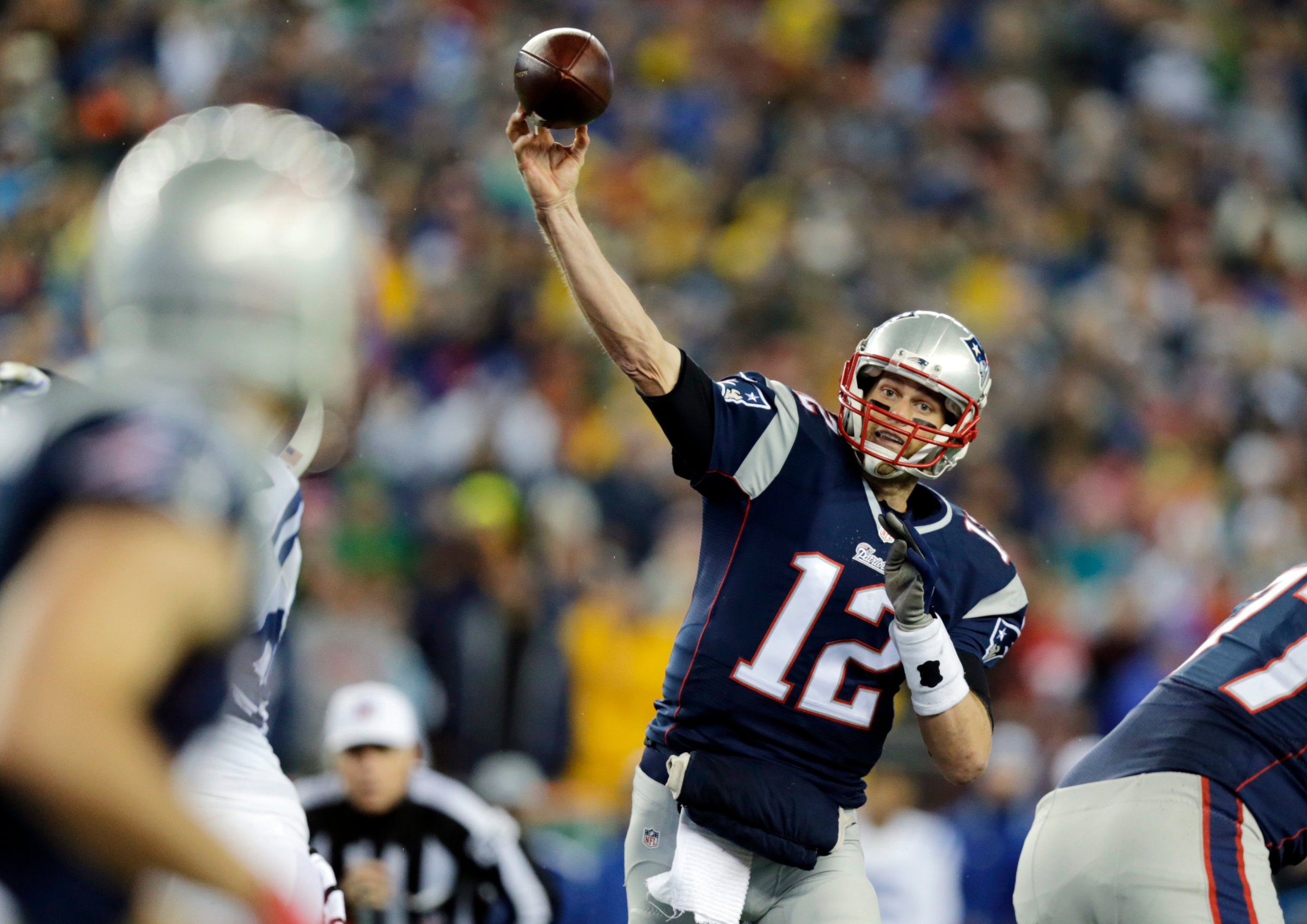New England Patriots quarterback Tom Brady throws a pass during the first half of the AFC championship NFL football game against the Indianapolis Colts in Foxborough, Mass on Jan. 18, 2015.