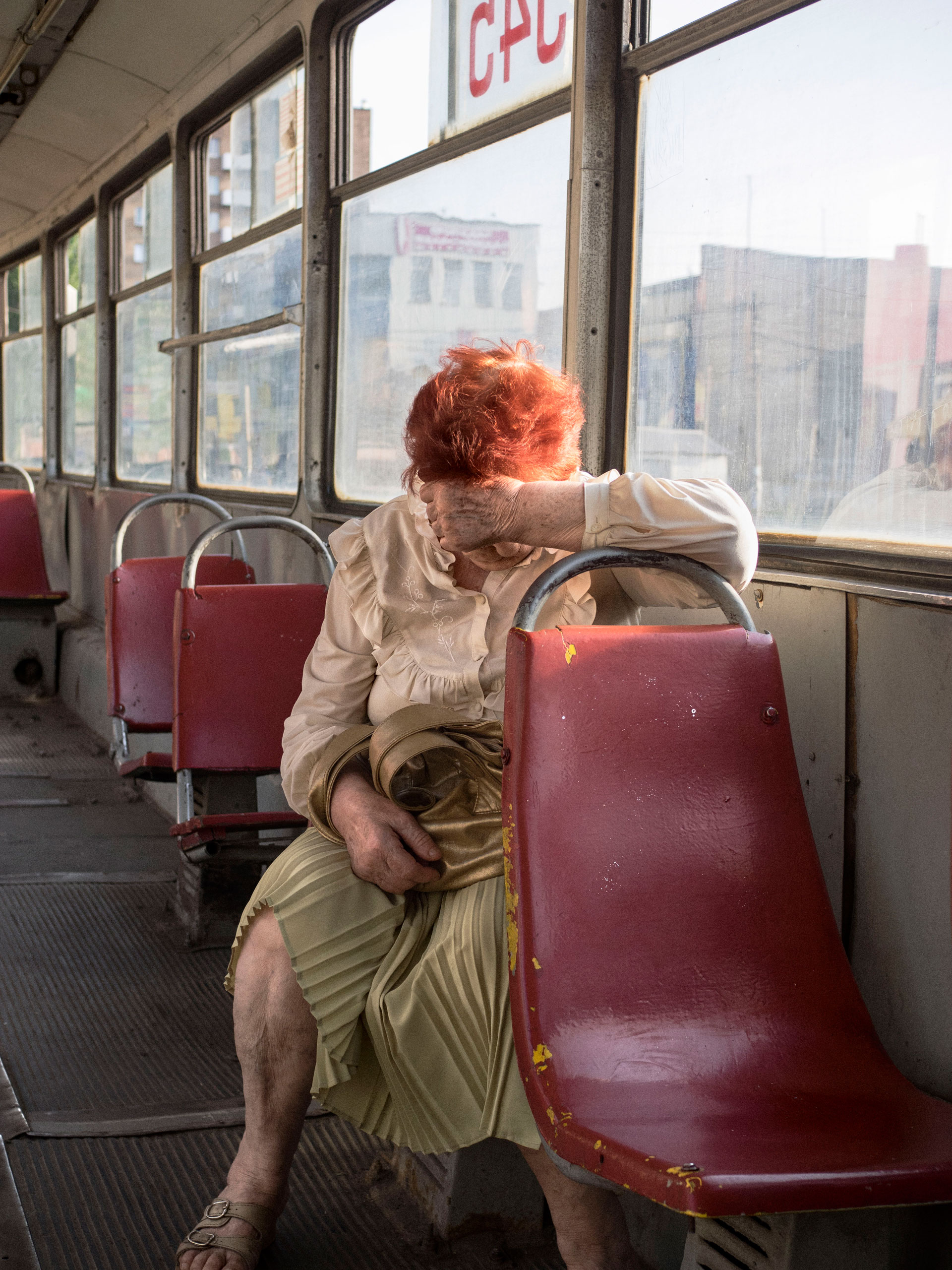 A woman on the tramway downtown. Mariupol, Ukraine. May 27, 2015.
