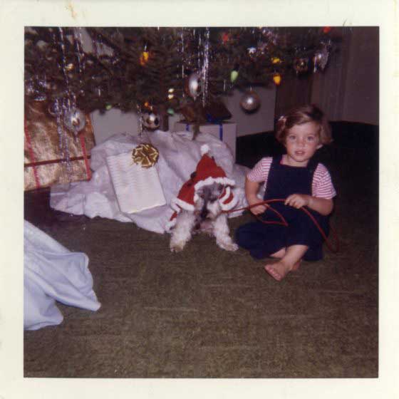Caroline Kennedy with her dog under the Christmas tree, Jan. 1961.