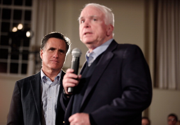 Republican presidential candidate and former Massachusetts Governor Mitt Romney (L) and former presidential nominee U.S. Sen. John McCain (R-AZ) hold a campaign town hall meeting at the Peterborough Town House January 4, 2012 in Peterborough, New Hampshire.