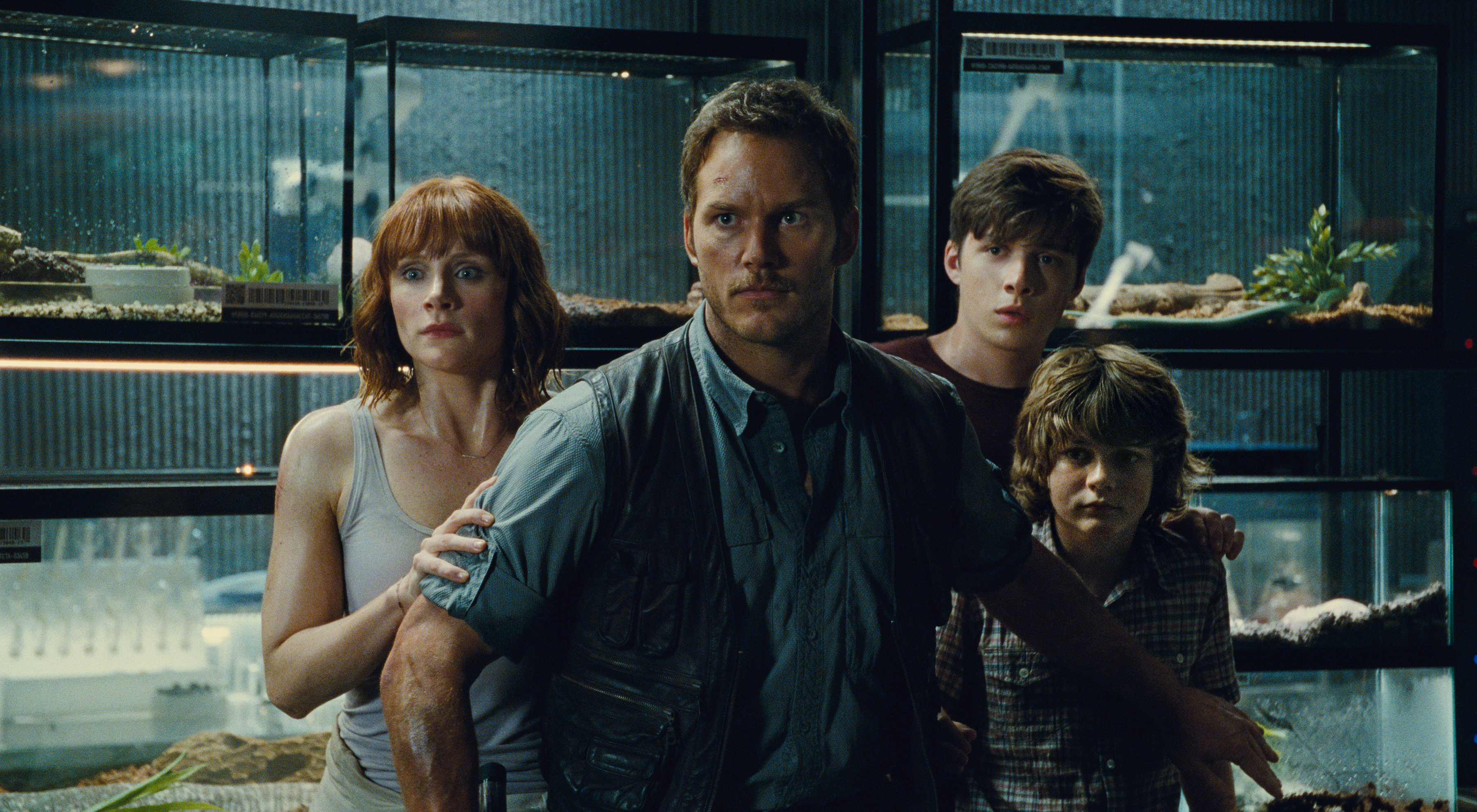 (L to R) Claire (Bryce Dallas Howard), Owen (Chris Pratt), Zach (Nick Robinson) and Gray (Ty Simpkins) watch in terror in Jurassic World. (Universal)
