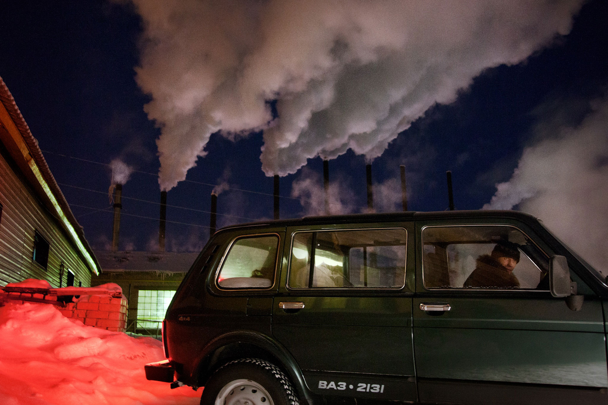 Car passes heating plant in Russian Arctic city