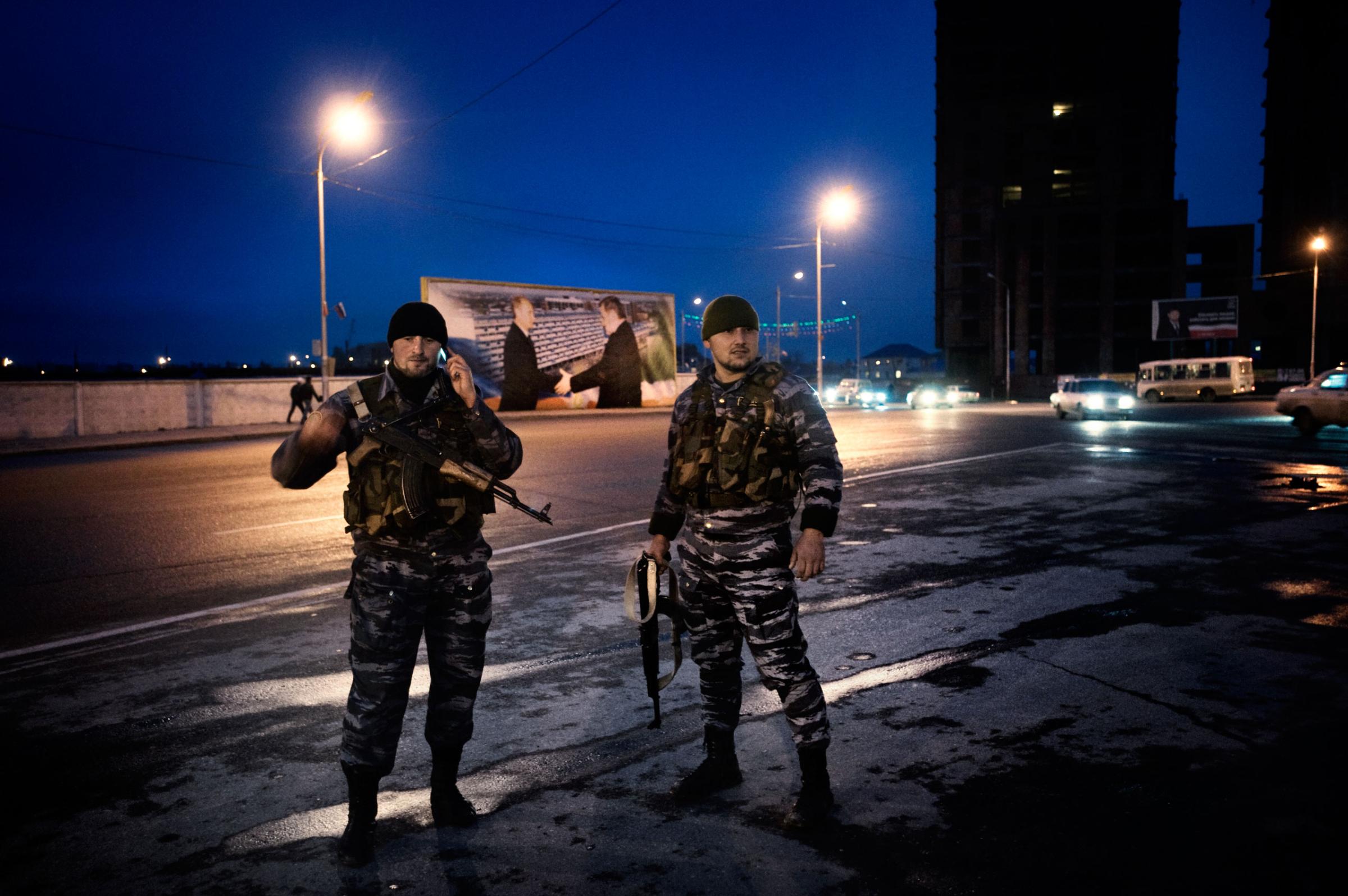 Chechen policemen, often targeted by rebels, guard a Grozny street with a billboard of Russian President Vladimir Putin and slain President Akhmad Kadyrov in the background, Nov. 2009.Yuri kozyrev—NOOR