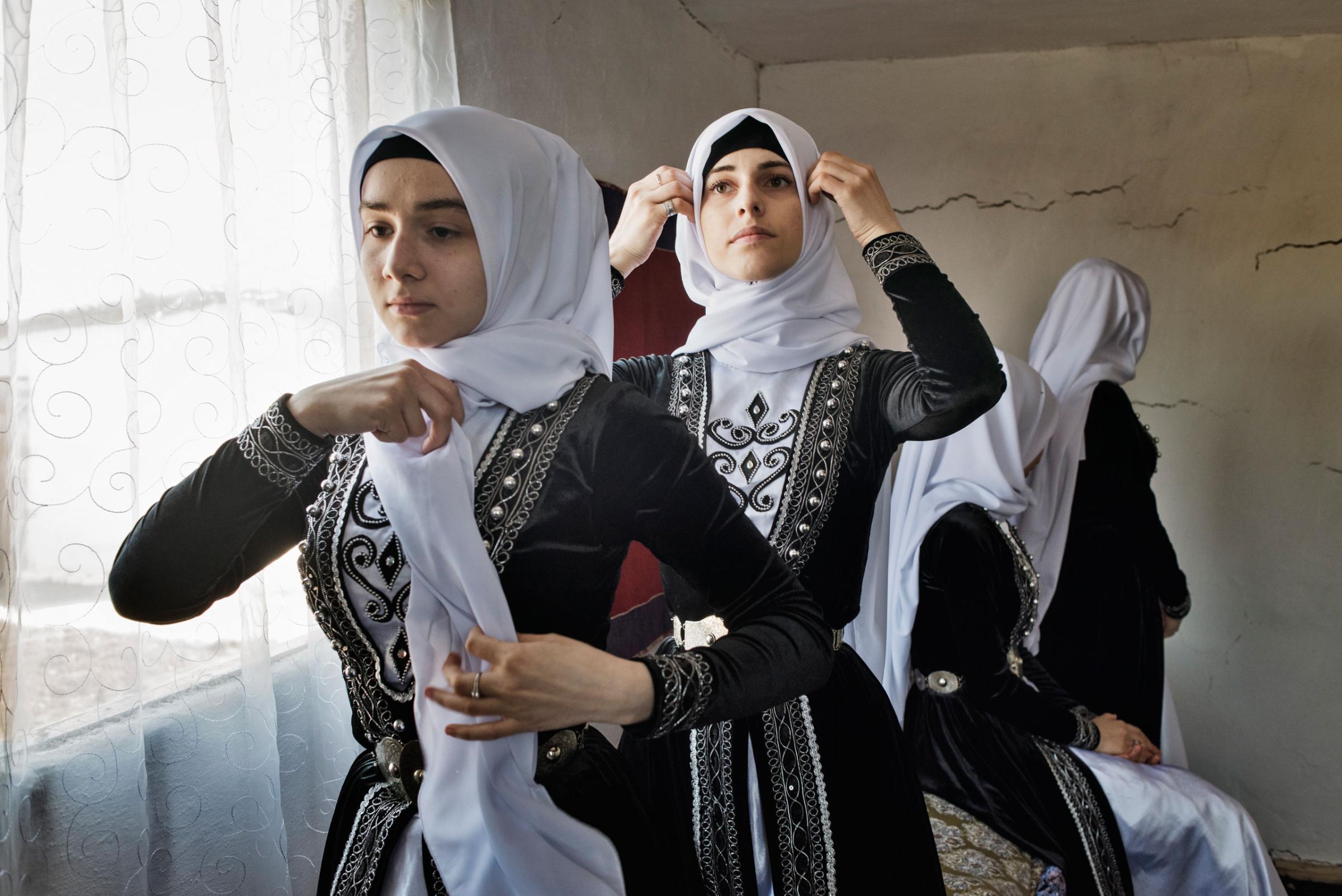 Young women in Chechnya await the arrival of Chechen leader Ramzan Kadyrov at a folk festival near the town of Shali, Chechnya, April 18, 2015. Yuri kozyrev—NOOR for TIME