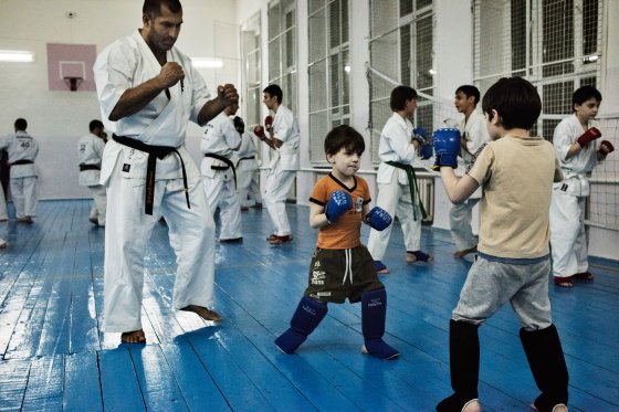Lechi Kurbanov, a world champion in karate and undefeated professional kickboxer, instructs students in karate at a gym in Grozny, Chechnya, April, 2015.Yuri kozyrev—NOOR for TIME
