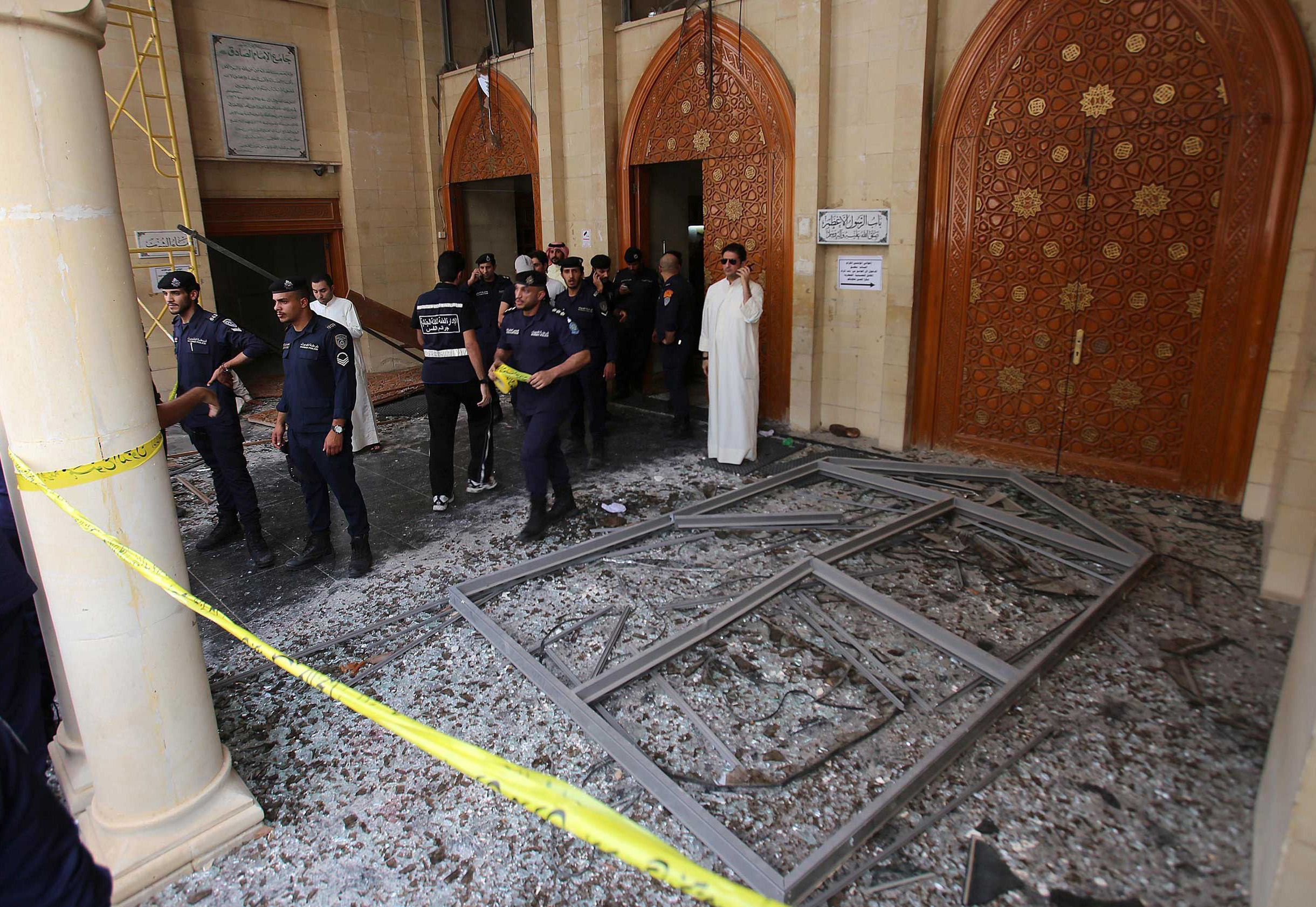 Kuwaiti security forces gather outside the Shii'te Al-Imam al-Sadeq mosque after it was targeted by a suicide bombing during Friday prayers in Kuwait City, on June 26, 2015, (Yasser Al-Zayyat—AFP/Getty Images)