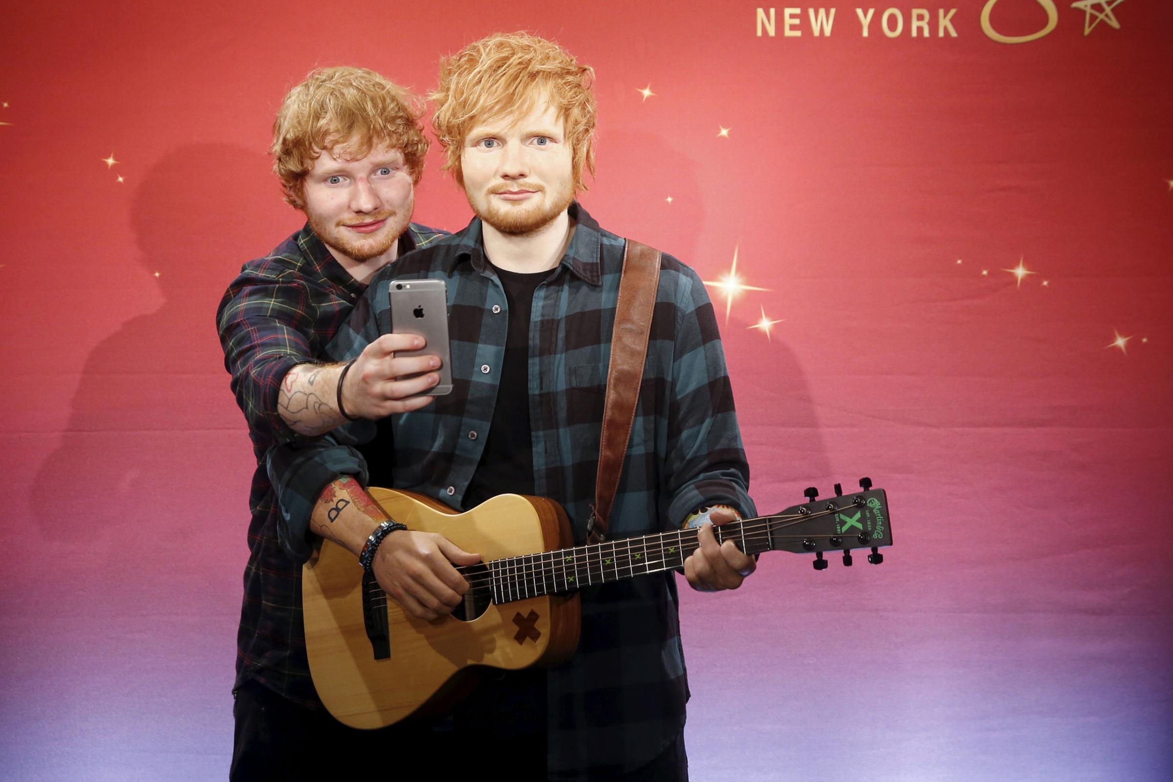 Musician Ed Sheeran takes a "selfie" with his wax figure at Madame Tussauds museum in the Manhattan borough of New York