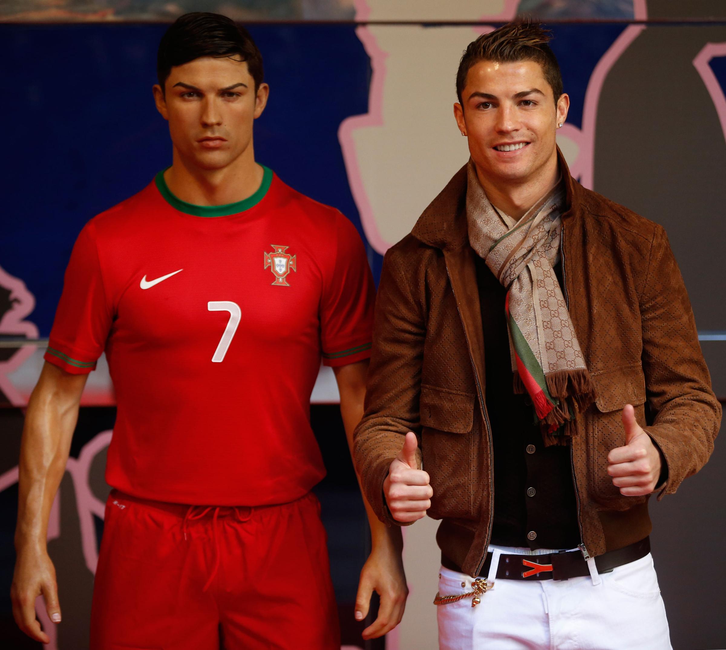 Cristiano Ronaldo, who plays for Real Madrid and Portugal's national soccer team, poses with his wax statue after an unveiling ceremony at the Madrid Wax Museum, in Madrid