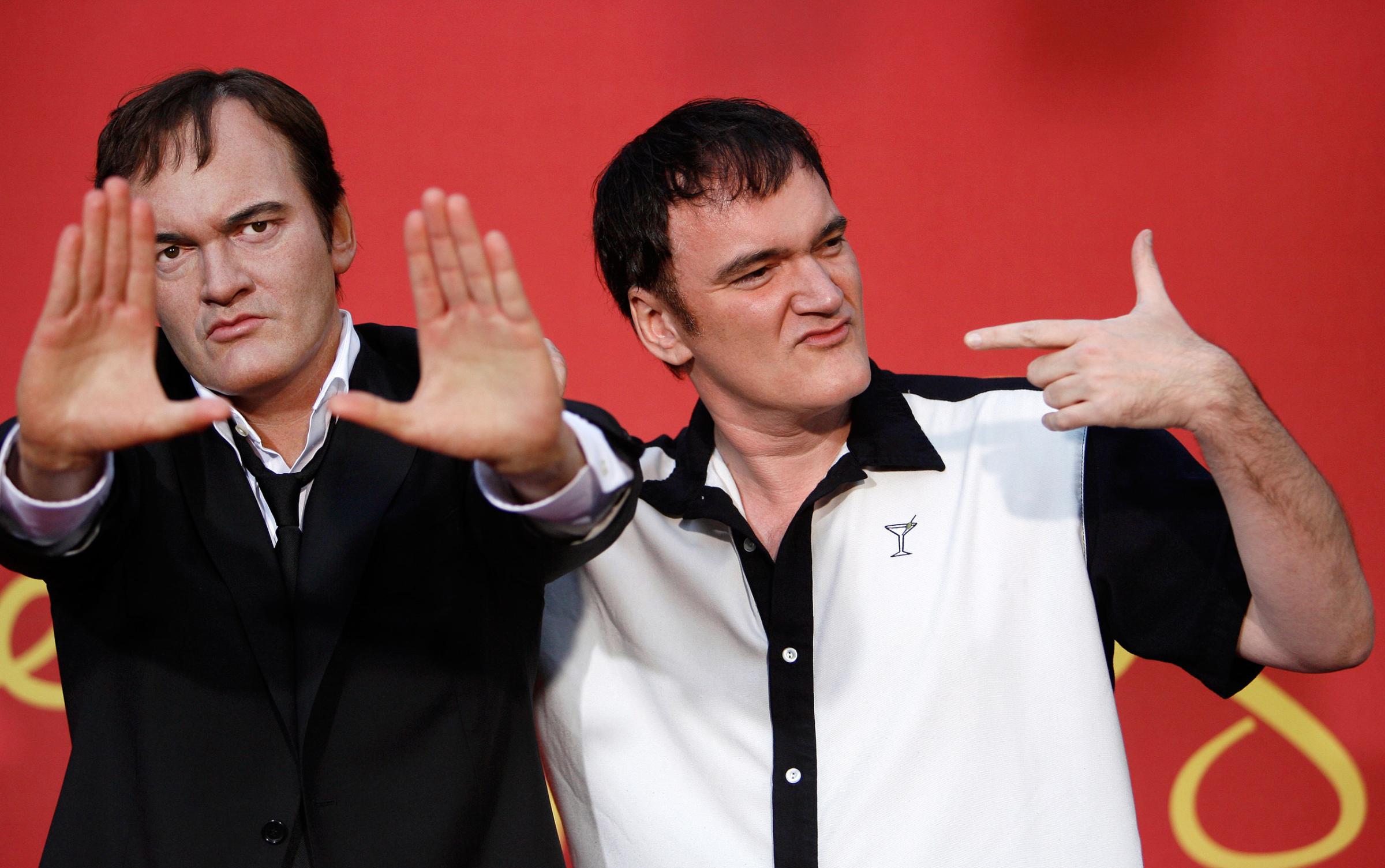 Tarantino poses next to his wax figure after it was unveiled at Madame Tussauds in Hollywood