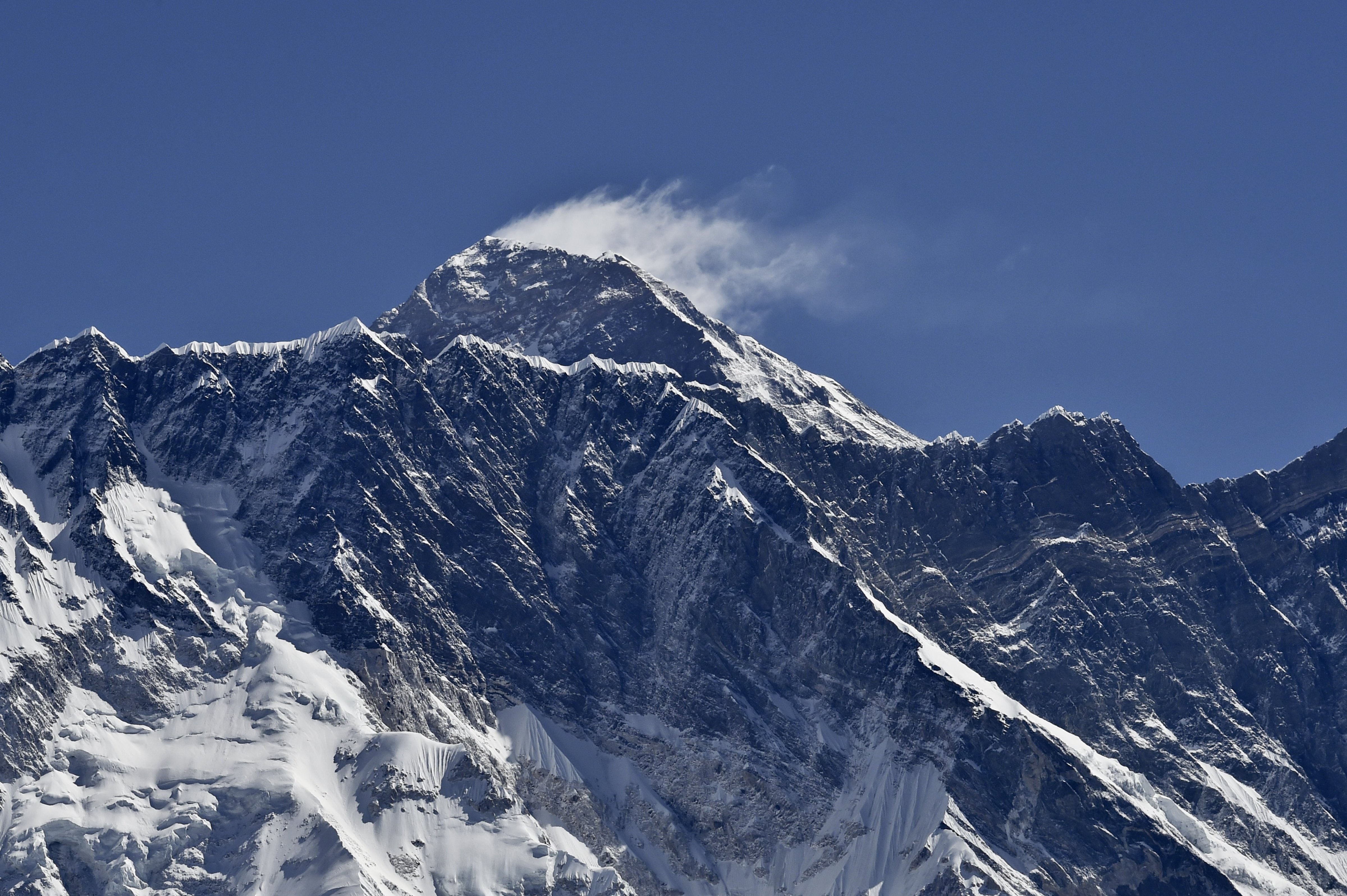 A view of Mount Everest towering over the Nupse, from the village of Tembuche in the Khumbu region of northeastern Nepal on April 20, 2015. (Roberto Schmidt—AFP/Getty Images)