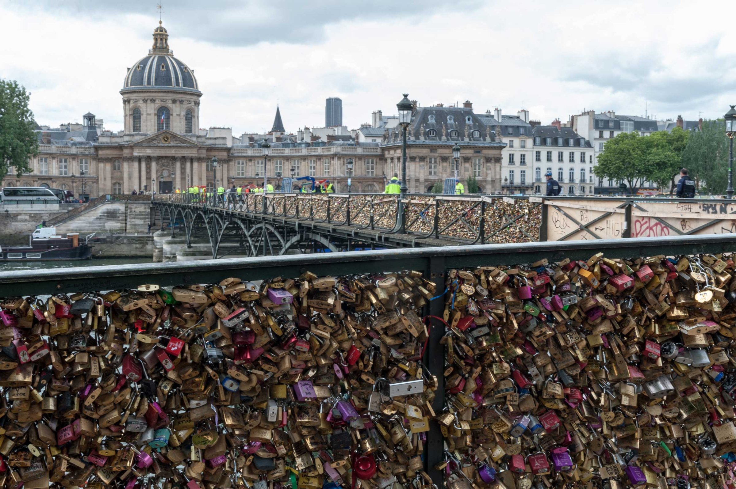 01 Jun 2015, Paris, France --- Paris, France. 1st June 2015 -- While workers make good progress in removing love locks attached to the Pont des Arts, there are many more to go. -- The city of Paris has started removing millions of so-called love locks from its historic bridges due to safety and aesthetic concerns. At Pont des Arts, workers cut away panels covered in locks, each one estimated to weigh on average about 400kg. --- Image by © Tim Anger/Demotix/Corbis