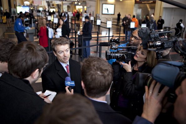 Senator Rand Paul, a Republican from Kentucky, speaks to the media after departing a flight at Ronald Reagan National Airport in Washington, D.C., U.S., on Monday, Jan. 23, 2012.