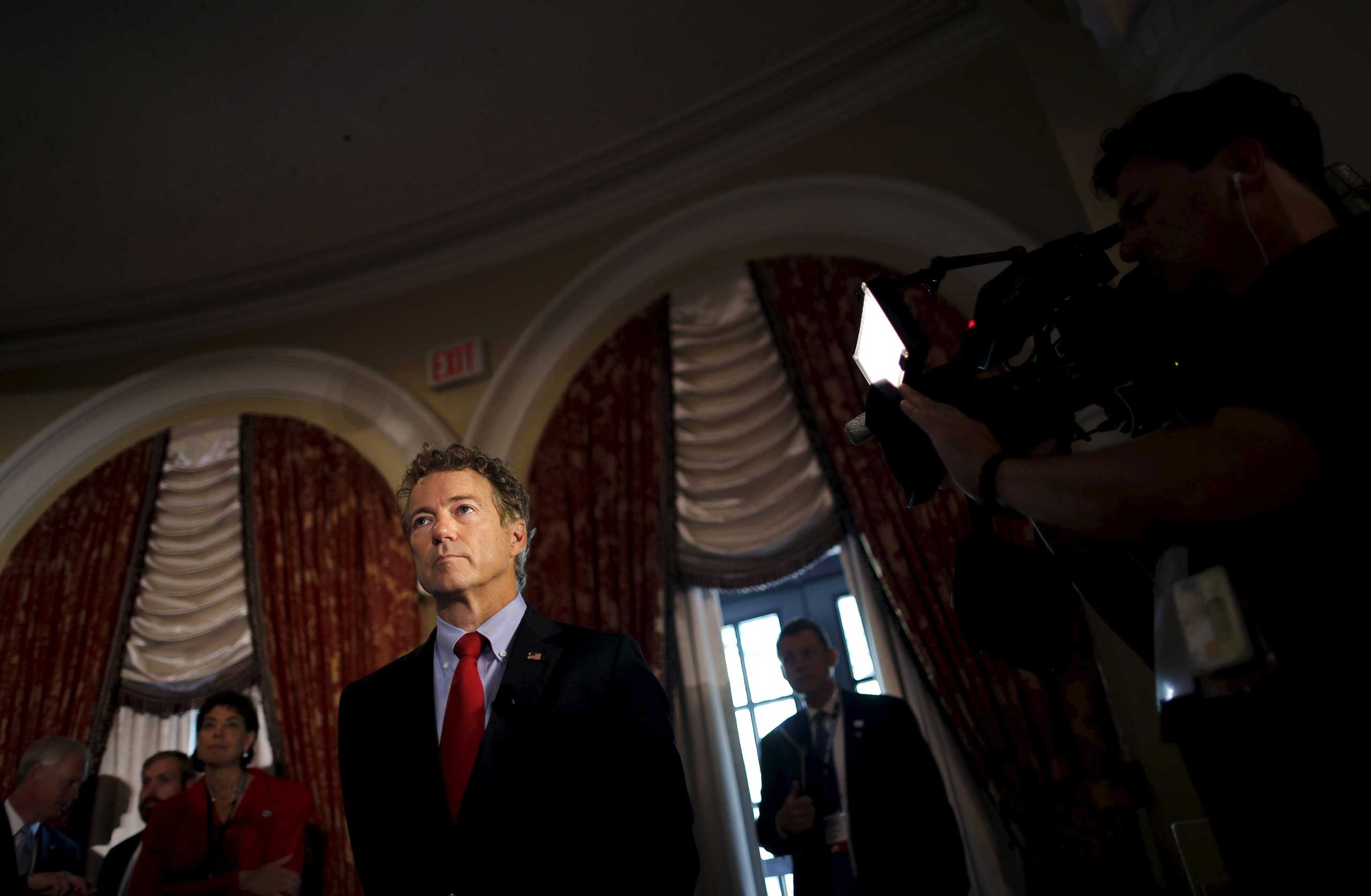 Republican presidential candidate Senator Rand Paul waits before addressing a legislative luncheon held as part of the 