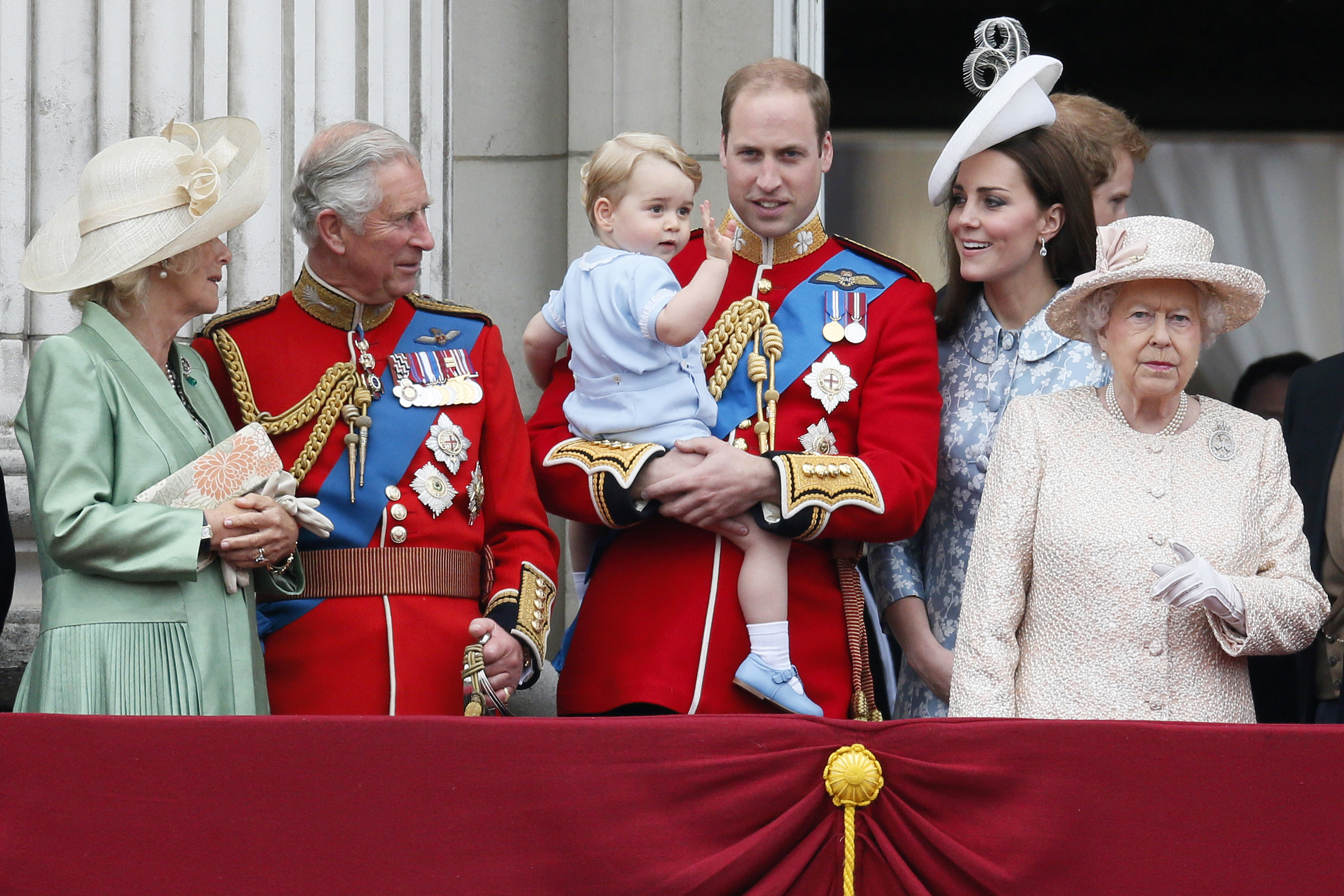 Britain's Camilla the Duchess of Cornwall, Prince Charles, Prince Willian holding Prince George, Catherine, the Duchess of Cambridge and Queen Elizabeth stand on the balcony at Buckingham Palace after attending the Trooping the Colour ceremony in London, June 13, 2015. (Stefan Wermuth—Reuters)