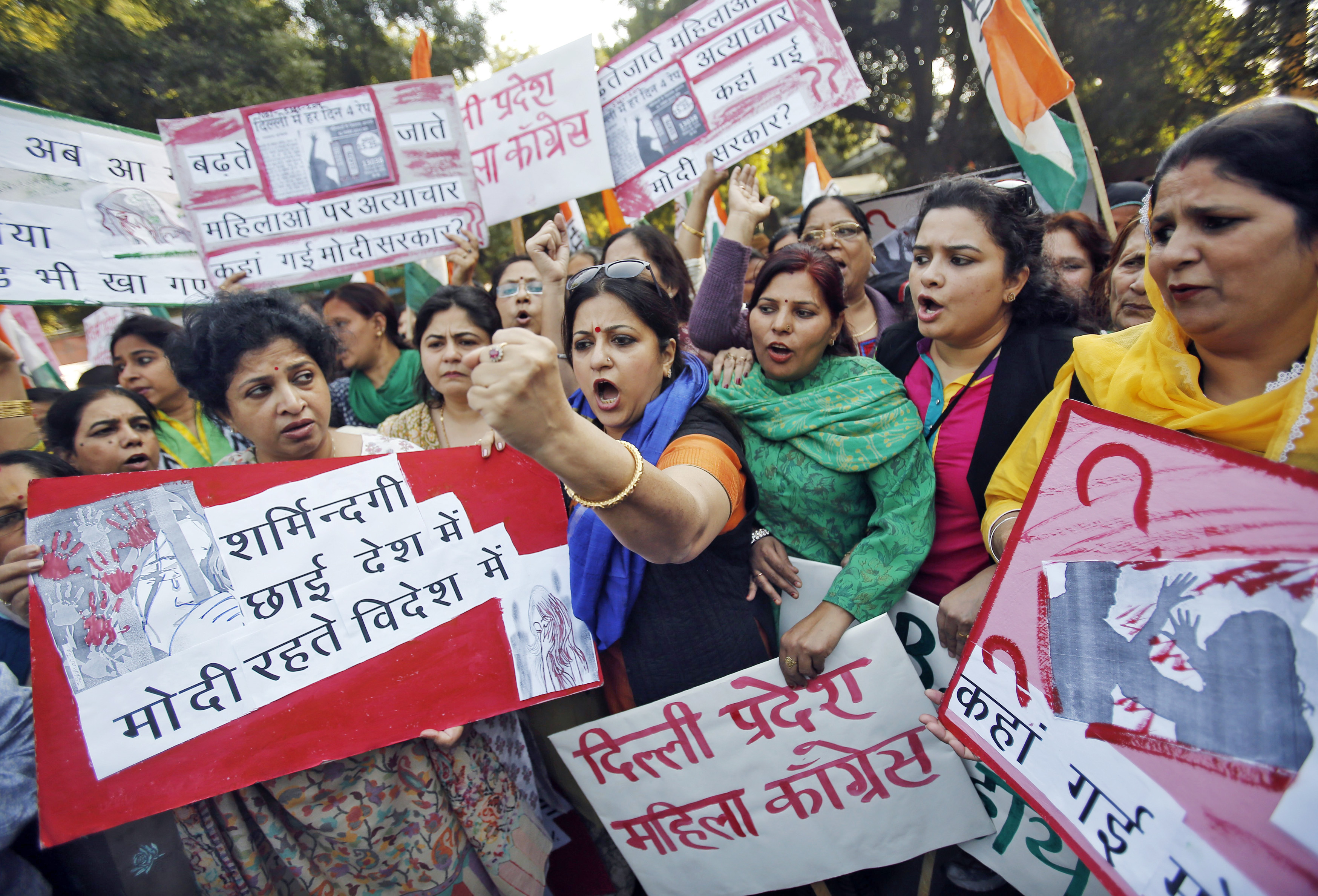 Members of All India Mahila Congress, women's wing of Congress party, shout slogans and carry placards during a protest against the alleged rape of a female Uber passenger, in New Delhi on Dec. 8, 2014 (Anindito Mukherjee—Reuters)