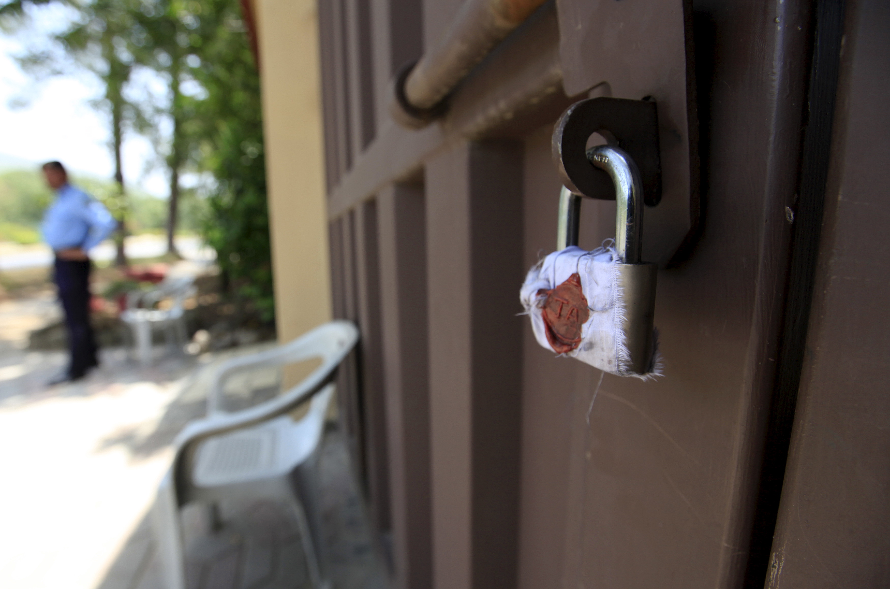 A sealed lock is seen at the gate of Save the Children charity's office in Islamabad, Pakistan, June 12, 2015 (Faisal Mahmood—Reuters)