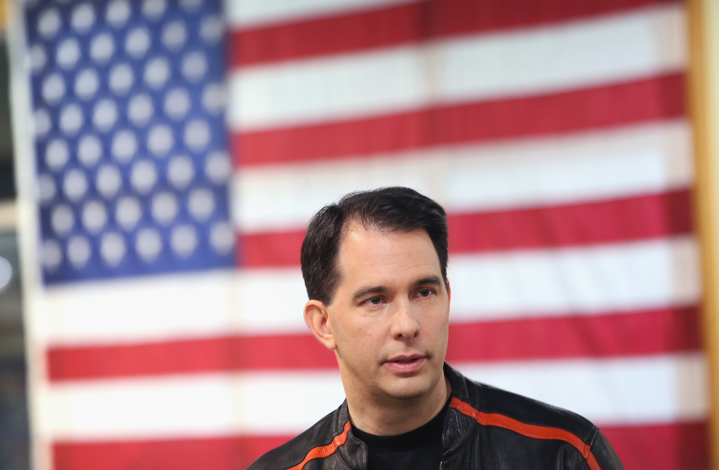 Wisconsin Governor Scott Walker gets ready to participate in a Roast and Ride event hosted by freshman Sen. Joni Ernst (R-IA) on June 5, 2015 near Des Moines, Iowa. (Scott Olson—Getty Images)