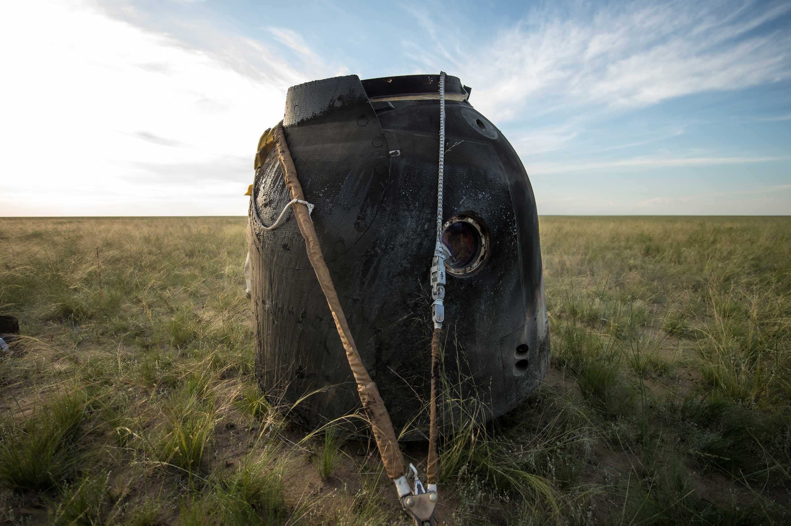 The Soyuz spacecraft returned from and came to rest in the desert near the town of Zhezkazgan, Kazakhstan, on June 11, 2015. Virts, Shkaplerov and Cristoforetti were still aboard the spacecraft in this photo. (Bill Ingalls—NASA)