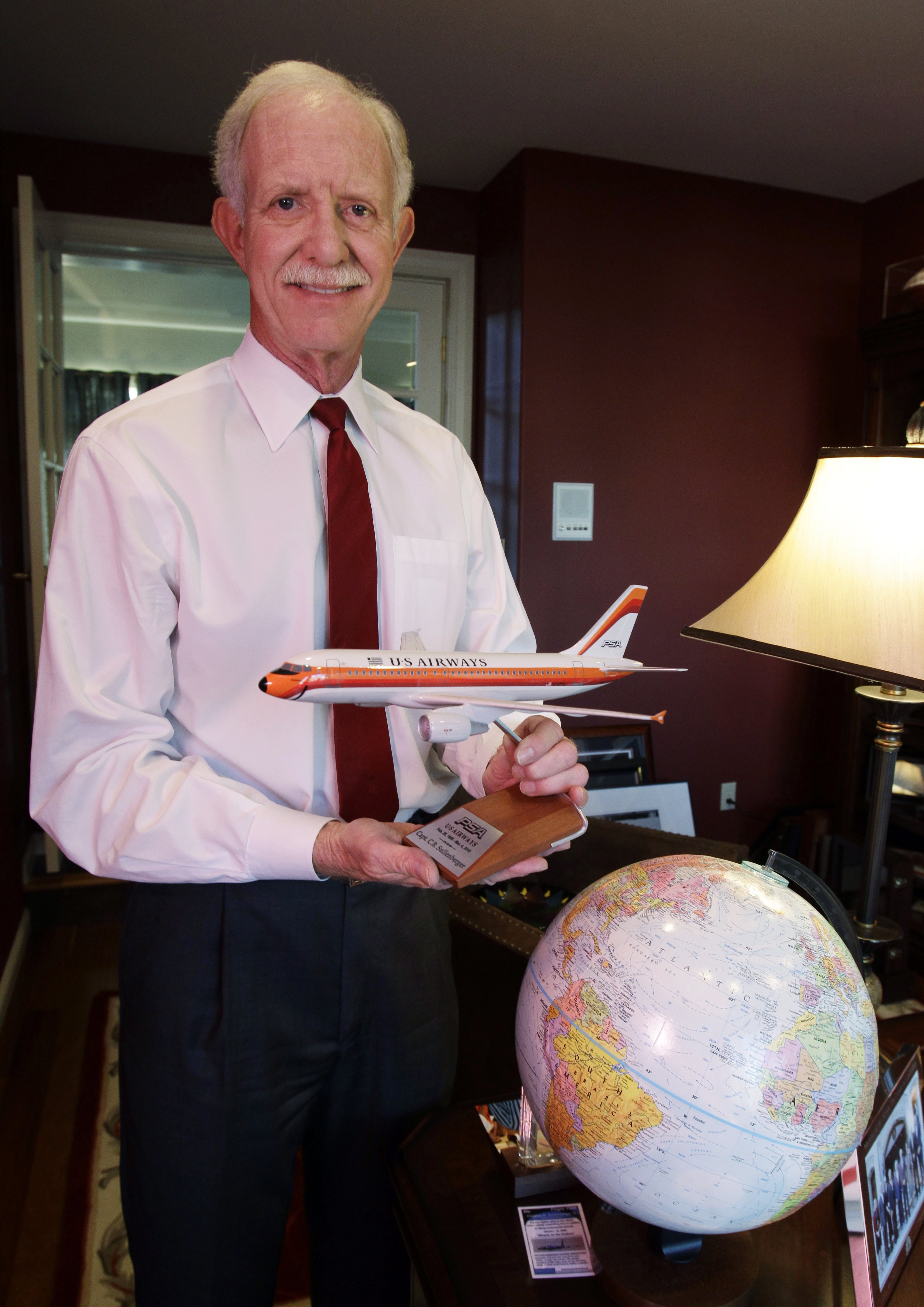 Chesley "Sully" Sullenberger captain of the US Airways flight #5149 that landed in New York's Hudson River in 2009, poses in his office at his home in Danville, Calif on Jan. 10. 2011. (Paul Sakuma—AP)