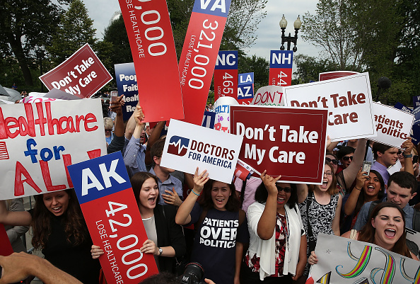 People cheer in front of the US Supreme Court after after ruliing was announced on the Affordable Care Act. June 25, 2015 in Washington, DC.