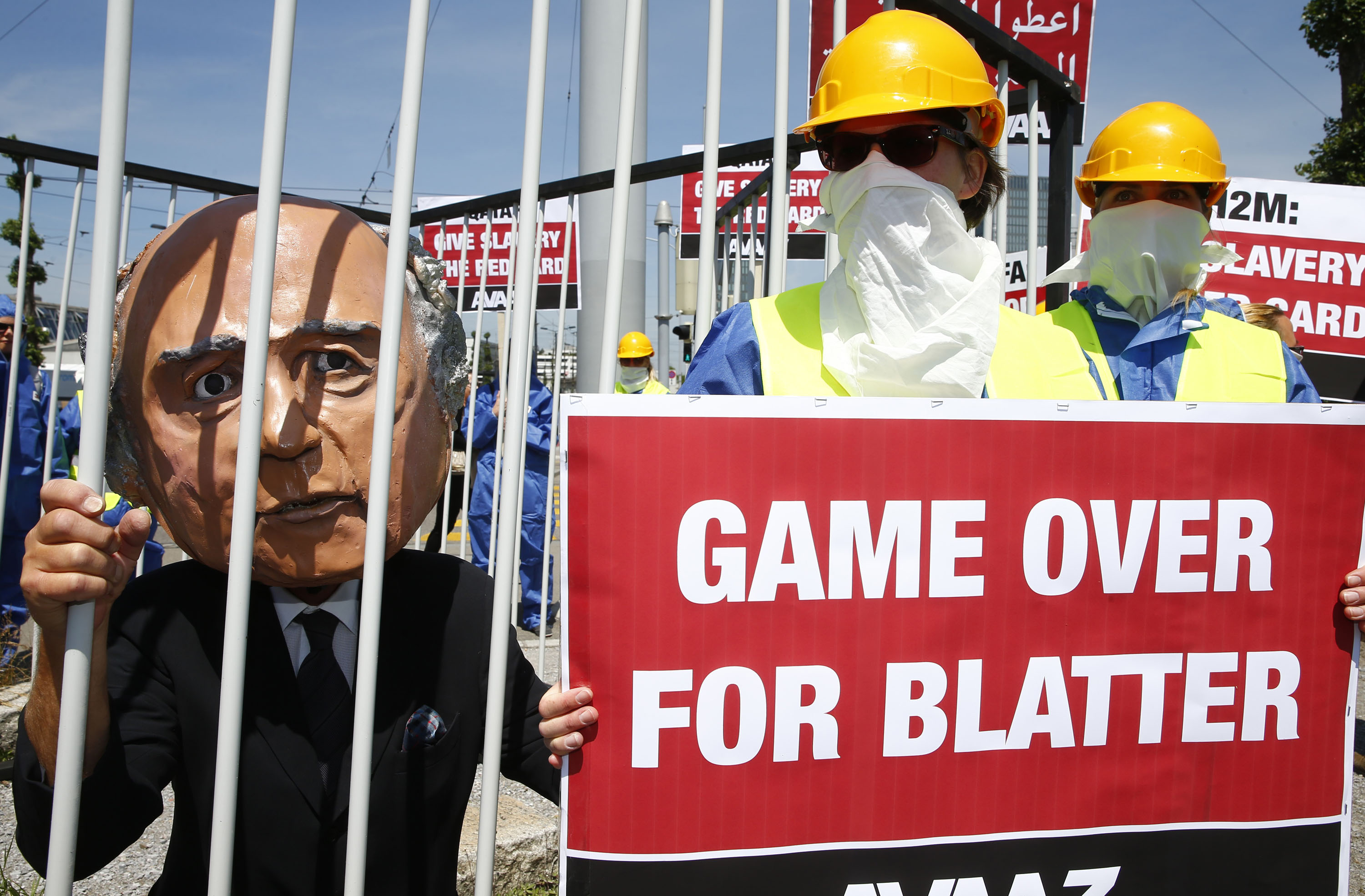Activists from the advocacy group Avaaz demand the resignation of FIFA President Sepp Blatter at a demonstration in Zurich on May 28. (Arnd Wiegmann—Reuters)