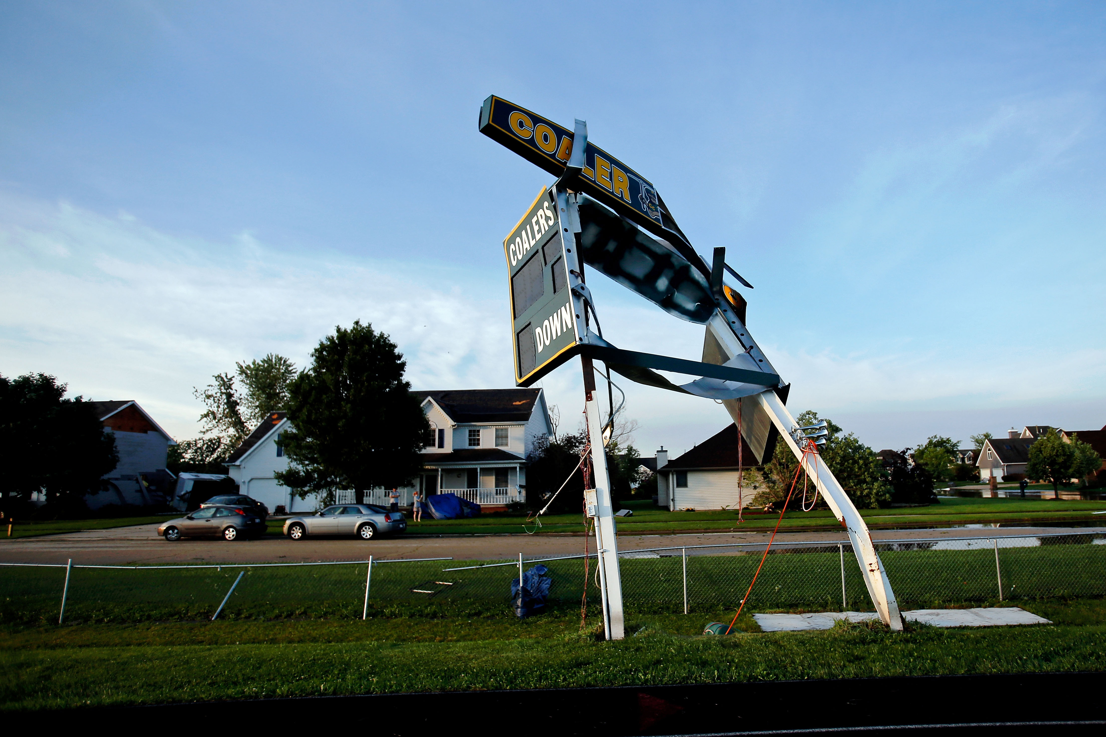 The scoreboard at Coal City High School's football field is left damaged after a tornado struck the previous day on June 23, 2015 in Coal City, Illinois. (Jon Durr—Getty Images)