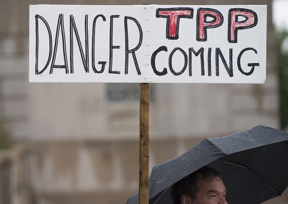 Demonstrators protest against the legislation to give President Barack Obama fast-track authority to advance trade deals, including the Trans-Pacific Partnership (TPP), during a protest march on Capitol Hill in Washington, DC, May 21, 2015.