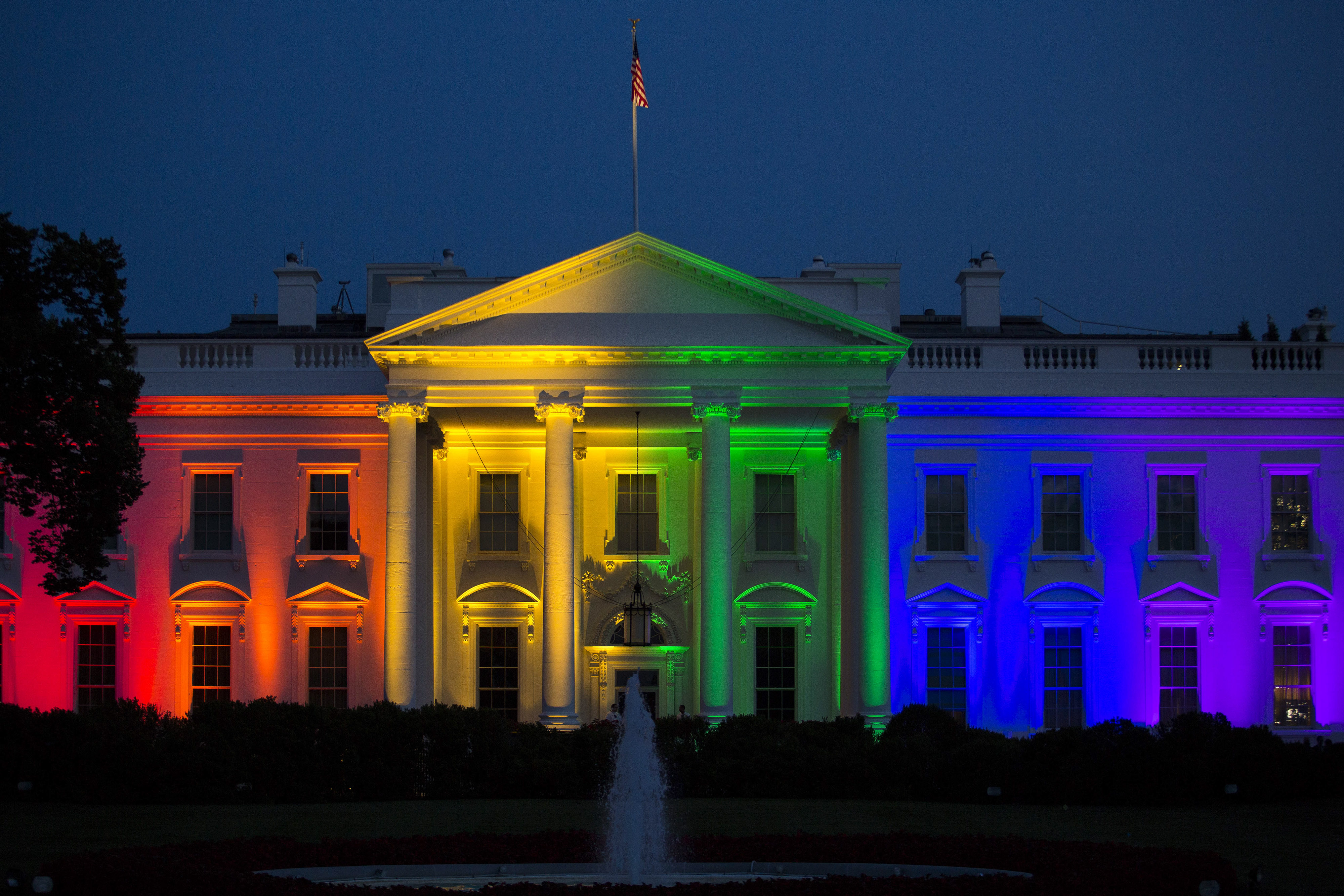 The White House stands illuminated in rainbow colored light at dusk in Washington, D.C., U.S., on Friday, June 26, 2015. (Drew Angerer&mdash; Bloomberg/Getty Images)