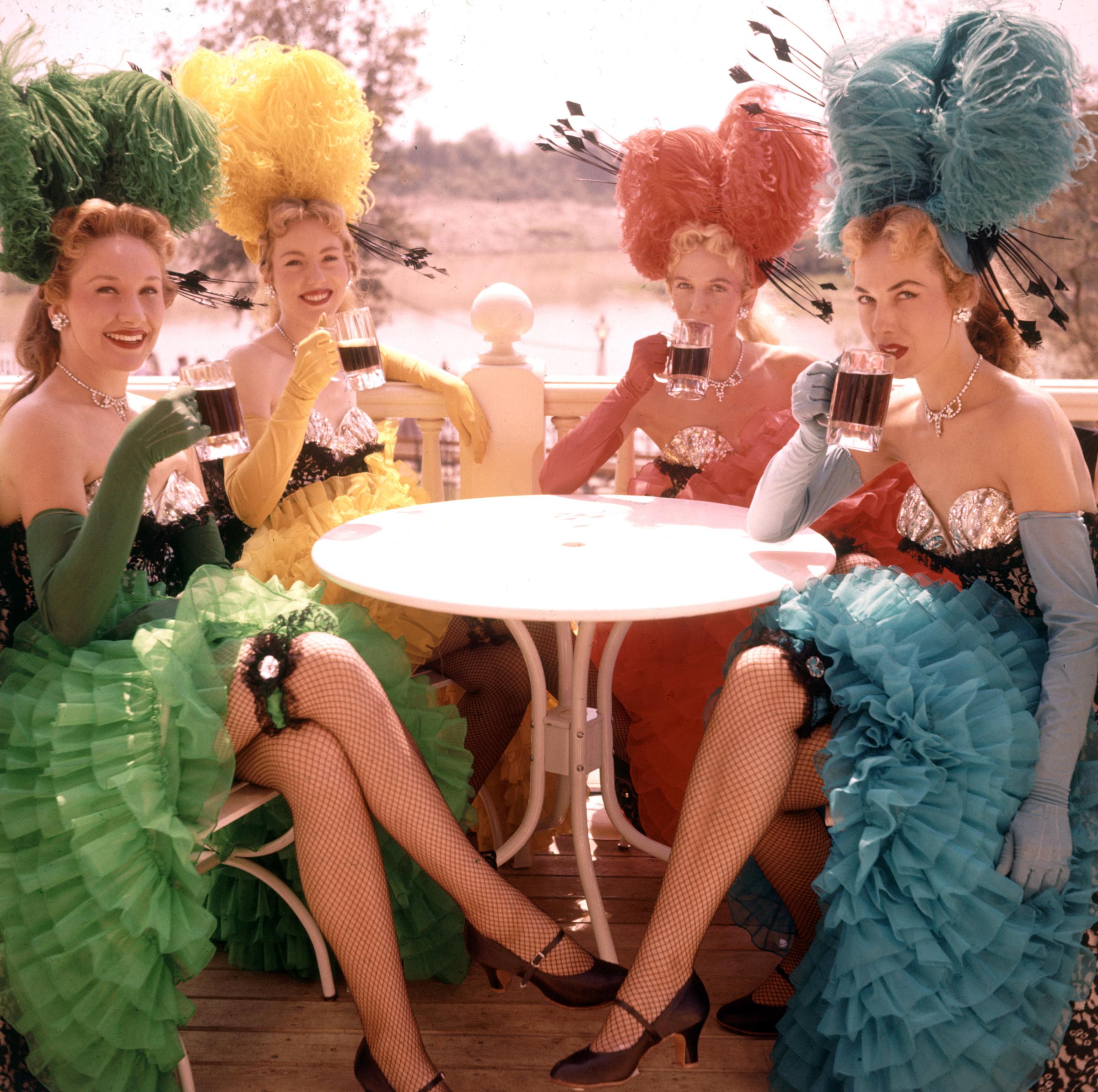 Showgirl performers taking a break and having a drink at Disneyland Amusement Park, 1955.