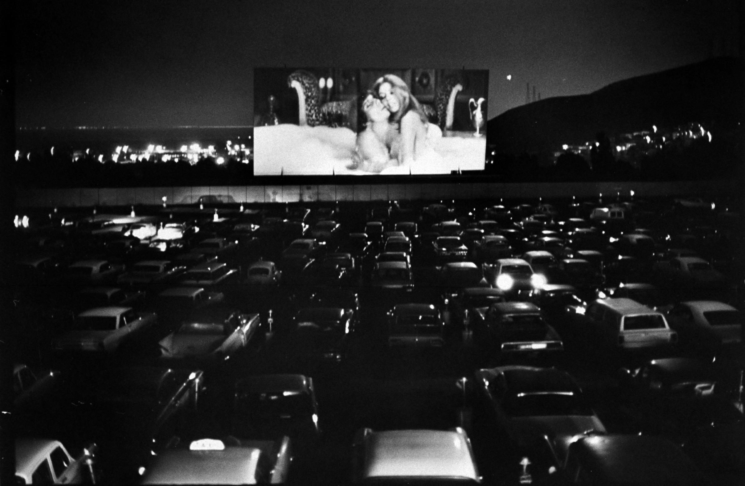Car-borne moviegoers jam a San Francisco drive-in to watch Beyond the Valley of the Dolls, first high-budget sex film done by Russ pioneer, "King of the Nudies."