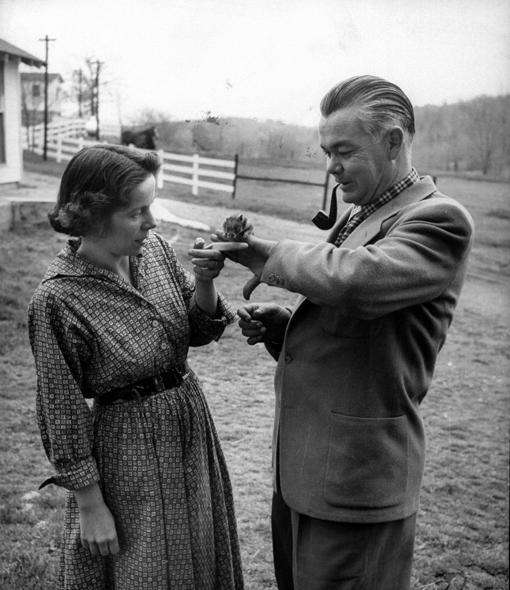 Trainers Marian and Dr. Keller Breland with their pet hamster, 1955.