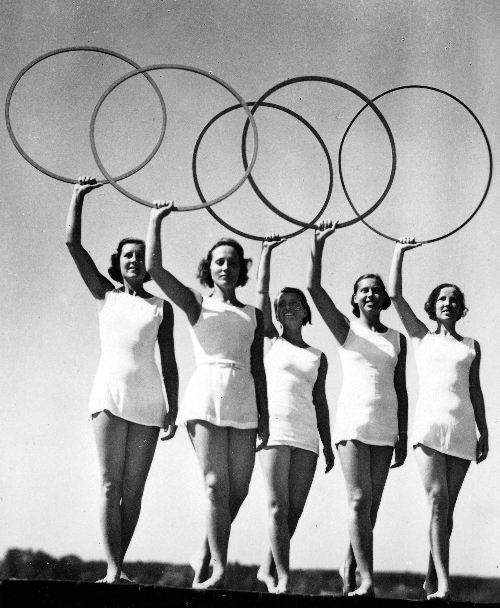 1936 Olympic Games, Berlin, Germany. Five young women take part in a display of the Olympic Rings.
