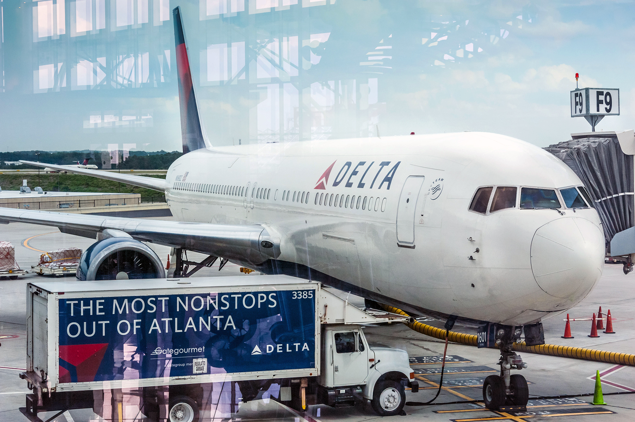 Delta Airlines passenger jet and service truck at Atlanta International Airport in Atlanta, Georgia, 2014.