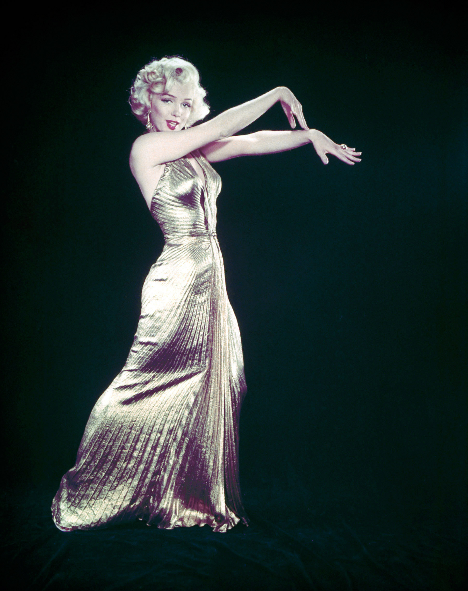 Marilyn Monroe wearing her famous gold lame gown designed by Bill Travilla for a publicity still for the motion picture "Gentlemen Prefer Blondes," 1953.