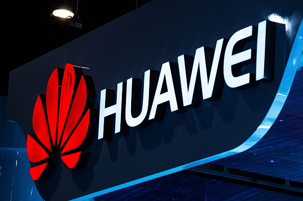 A logo sits illuminated outside the Huawei pavilion during the second day of the Mobile World Congress 2015 at the Fira Gran Via complex on March 3, 2015 in Barcelona, Spain (David Ramos—Getty Images)